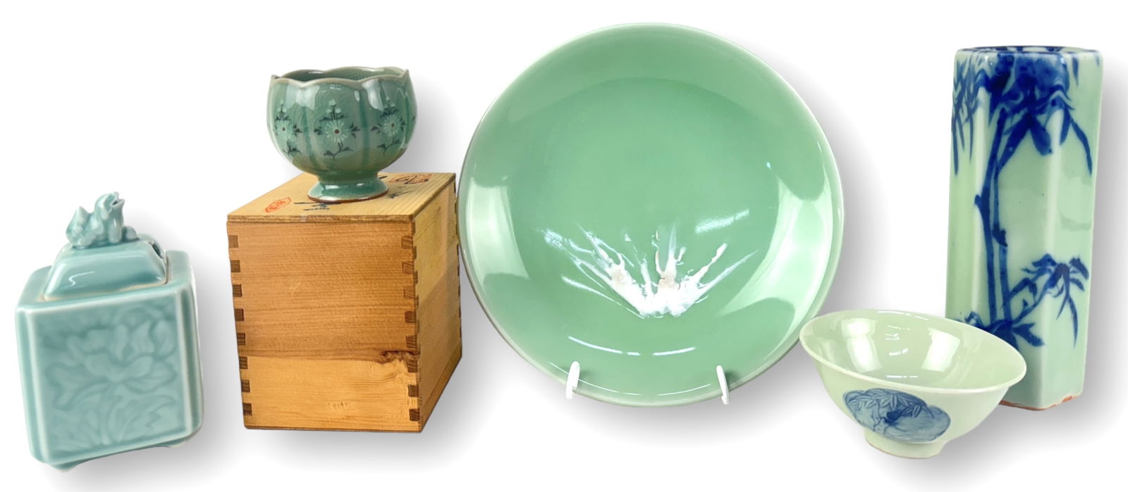 Group of Asian Celadon Colored Pieces: For size reference, plate measures at: 1 1/2" tall x 9 1/2" across Condition: Crazing on small cup shape dish on wooden box. No chips or cracks. See photos.