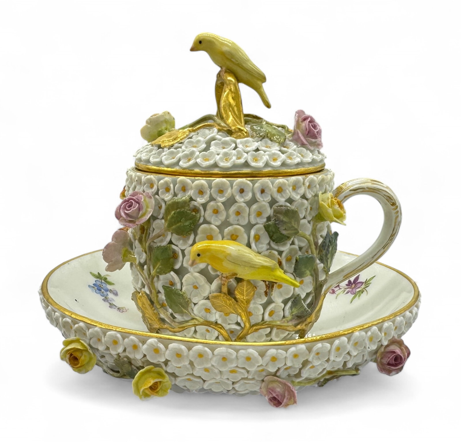 Meissen Schneeballen Porcelain Cup and Saucer: Meissen Schneeballen porcelain cup and saucer with birds and flowers. Cup: 2" diameter; 4" tall (with lid) Saucer: 5" diameter Stamped "75" just below the crossed-swords, which have a horizontal line 