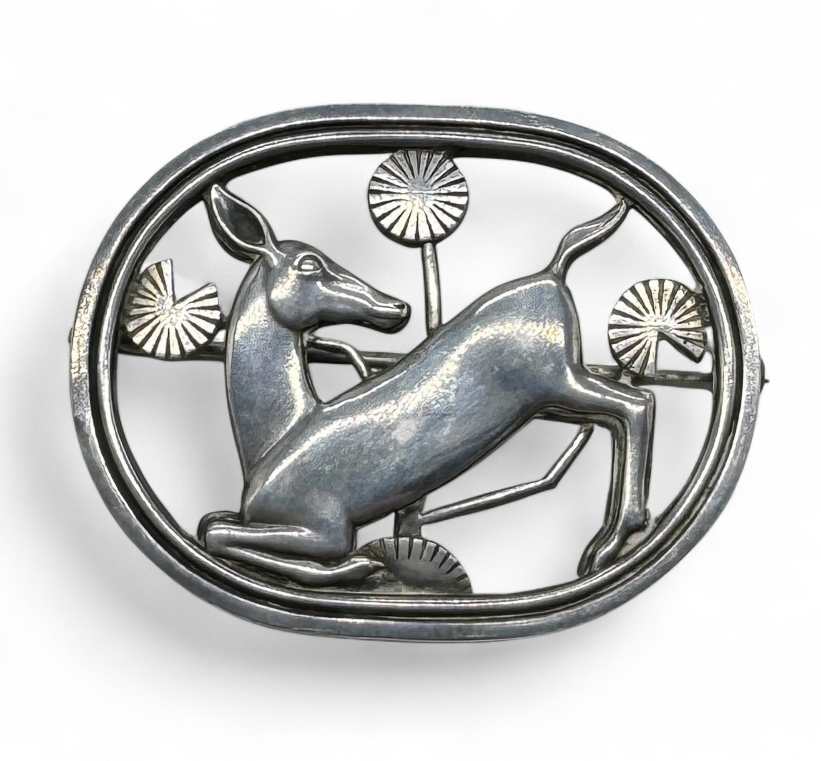 Georg Jensen Deco Deer Sterling Brooch: Vintage Danish Art Deco brooch marked sterling, with a deer design. Dimensions: 1 3/8" x 1 3/4" Condition: small scratches on deer, otherwise in good condition