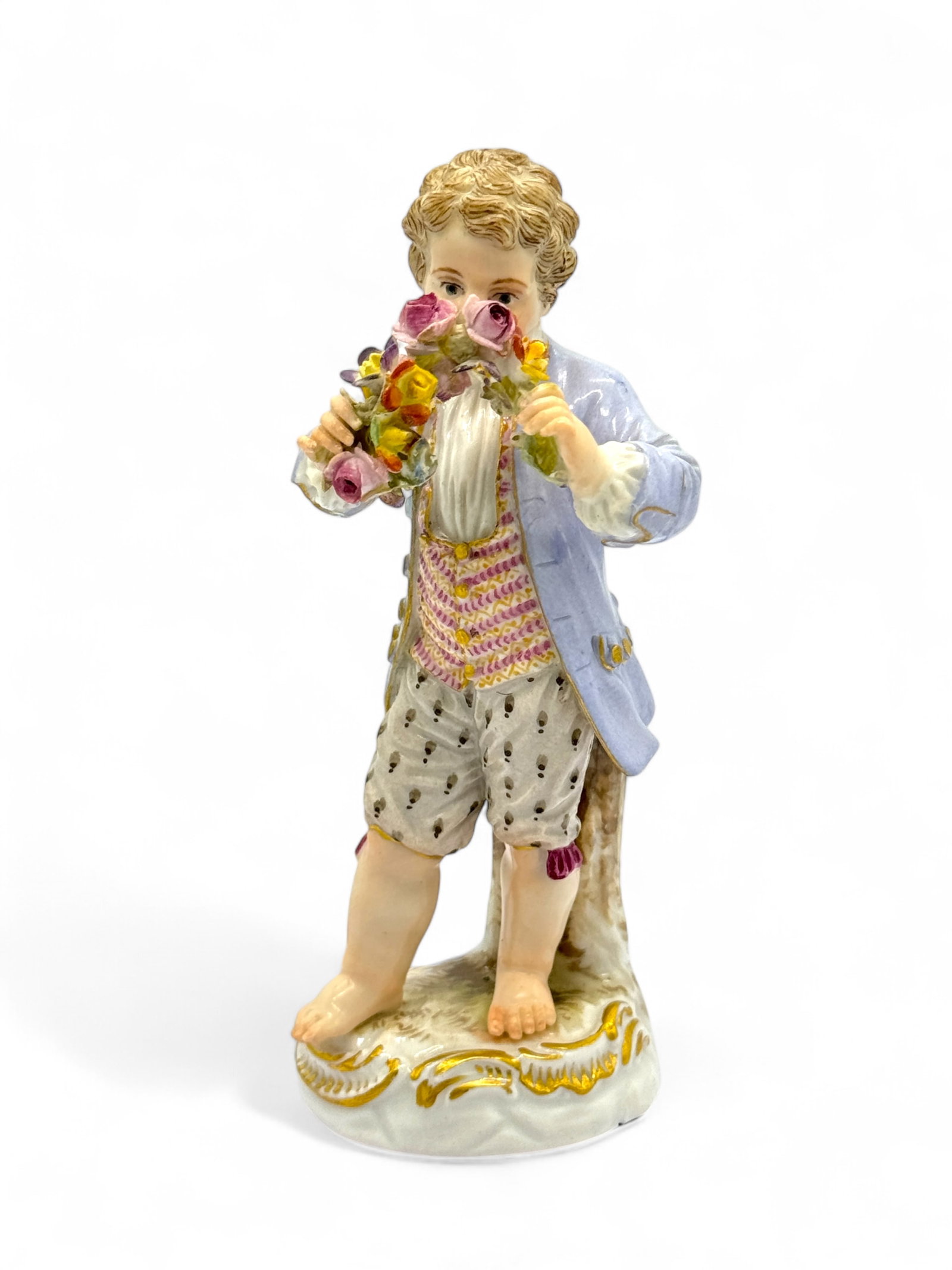 Meissen Porcelain Boy Holding Arch Of Flowers: Meissen crossed swords on the bottom. Dimensions: 4 3/4" Condition: very good