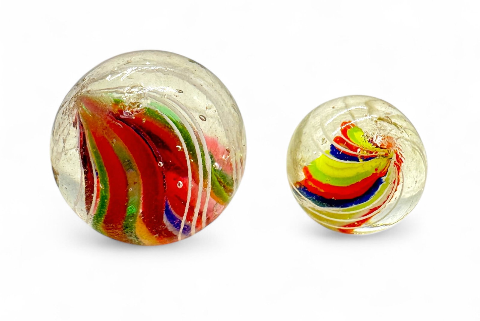(2) Vintage Multi-Colored Divided Core Marbles: Size: 16mm - 22mm Condition: light wear consistent with age