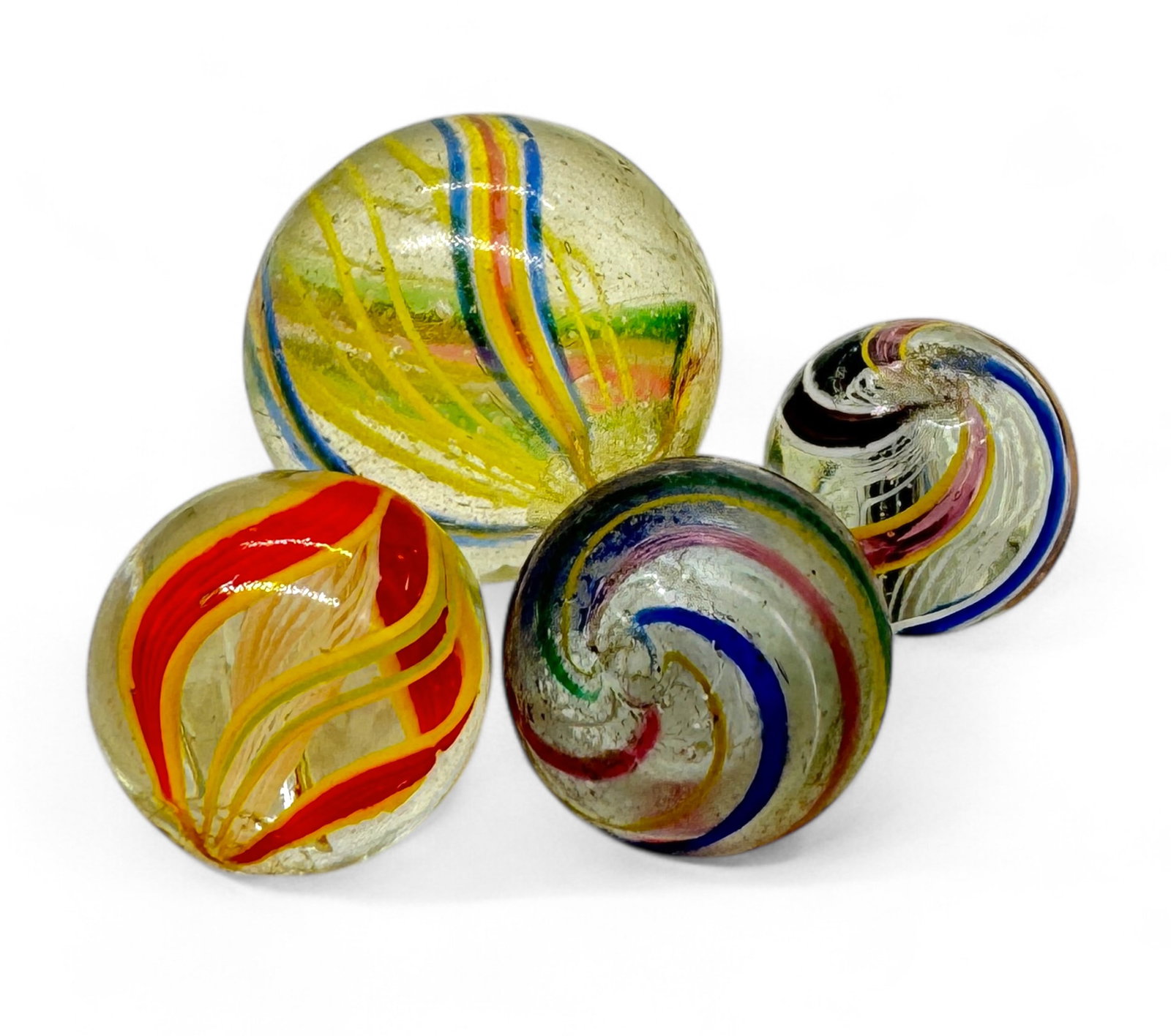 (4) Latticinio Swirl Core Marbles: Size: 22mm - 14mm Condition: few minor chips
