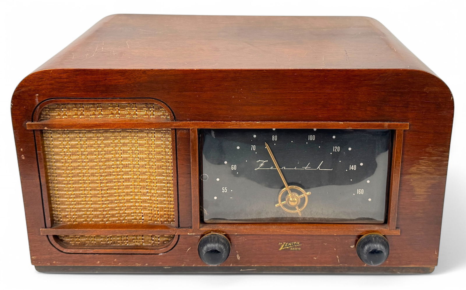 Charles & Ray Eames Zenith 4K035 Radio & Battery: Marked on the front "Zenith Radio". Bakelite, walnut plywood, fabric & brass. Eveready A-B radio battery pack, No. 759 included.Dimensions: 17" wide x 10 1/2" deep x 9" ta