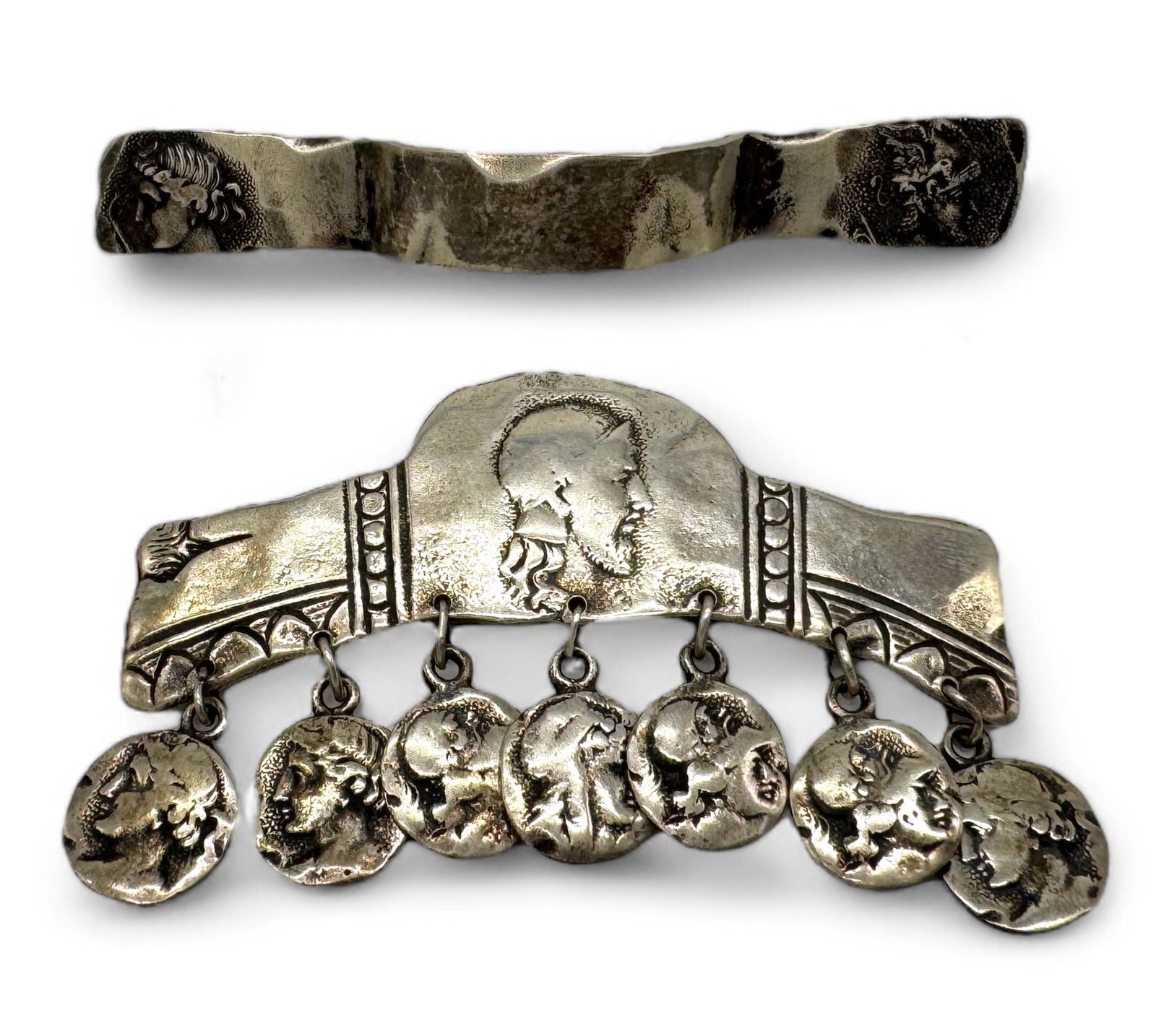 (2) George Shiebler Etruscan Sterling Brooches: Roman coin motif brooches, one marked with maker's mark, “STERLING 471” on the back, the other is marked “STERLING” as well as maker’s mark and number, though th