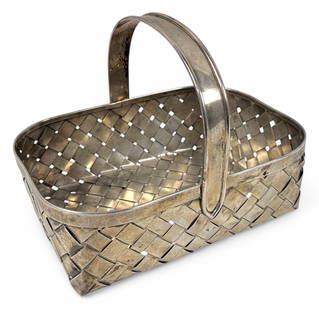 Large Cartier Sterling Silver Handmade Basket: Signed "Cartier HANDMADE Sterling" on the bottomSize: 7 1/2" tall x 10" wideWeight: 18.9oztCondition: some light tarnish and scratches. Minor indent on the bottom of interior.