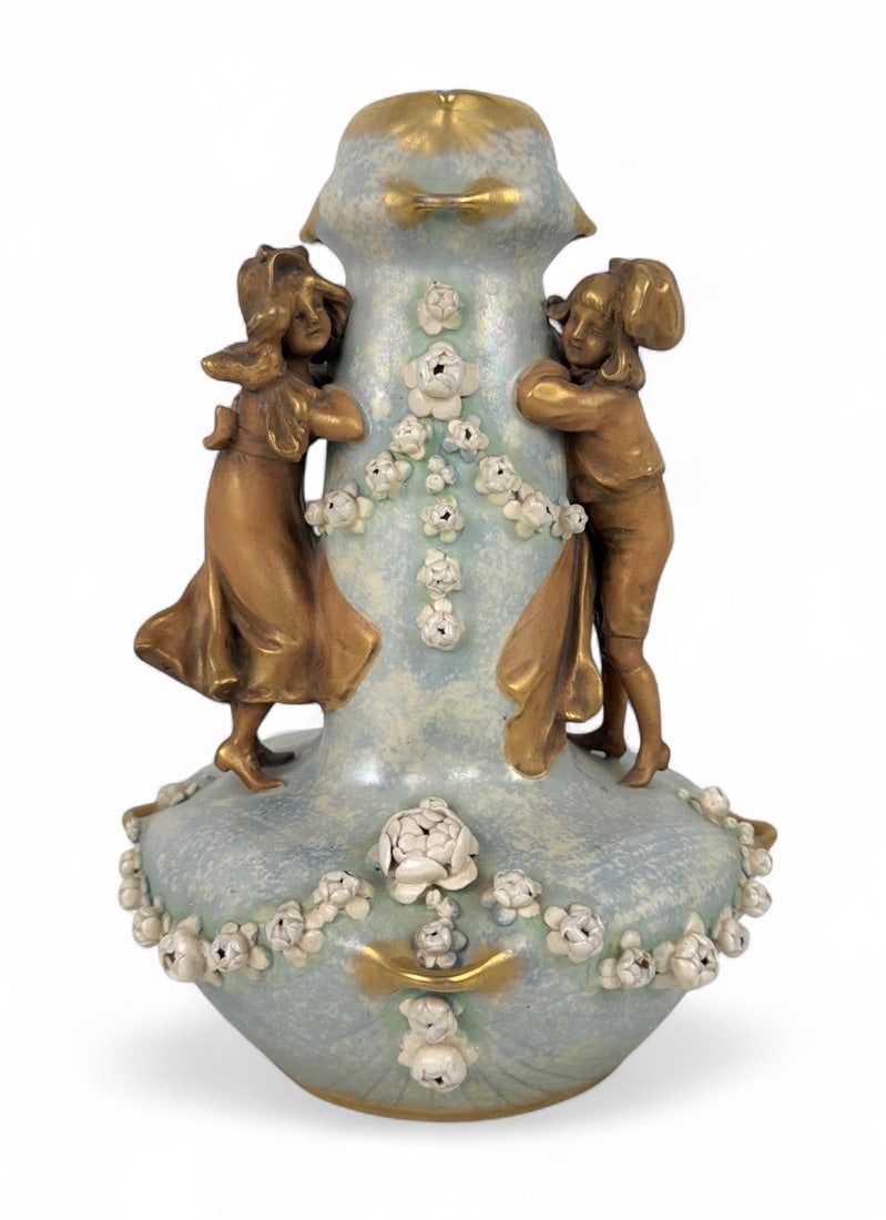 Amphora-Werke Riessner, Stellmacher & Kessel, Vase: Boy & Girl Floral Motif. Height: 11" Base Diameter: 5" Condition: Very good with no chips or cracks. About: Amphora-Werke Riessner, Stellmacher & Kessel was a renowned ceramics manuf