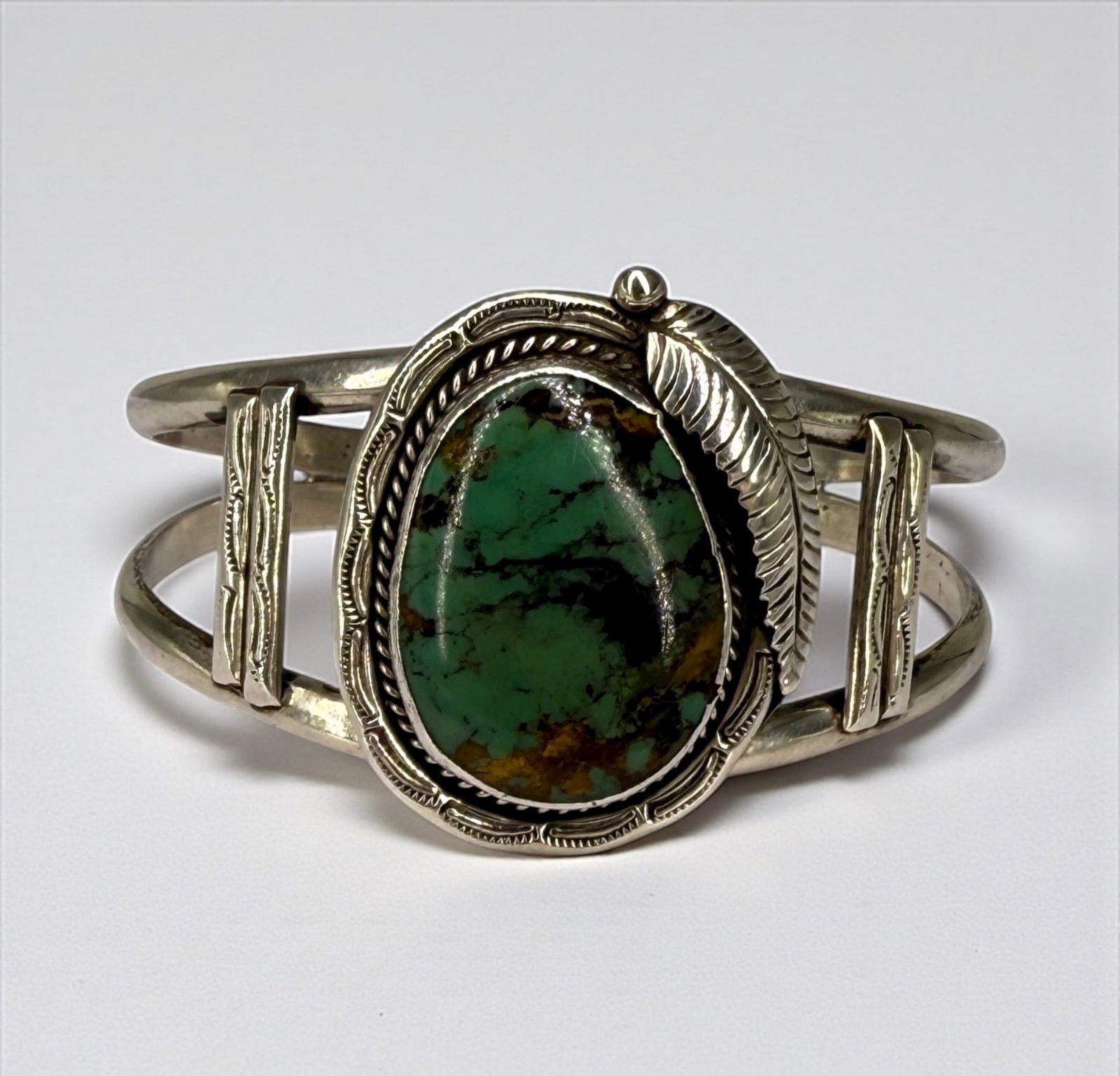 Joe Willie Navajo Sterling Silver and Turquoise Cuff Bracelet: Size: 5 1/2" around with a 1" opening Weight: 33g Condition: Very Good- Light tarnish and surface wear consistent with age and use.