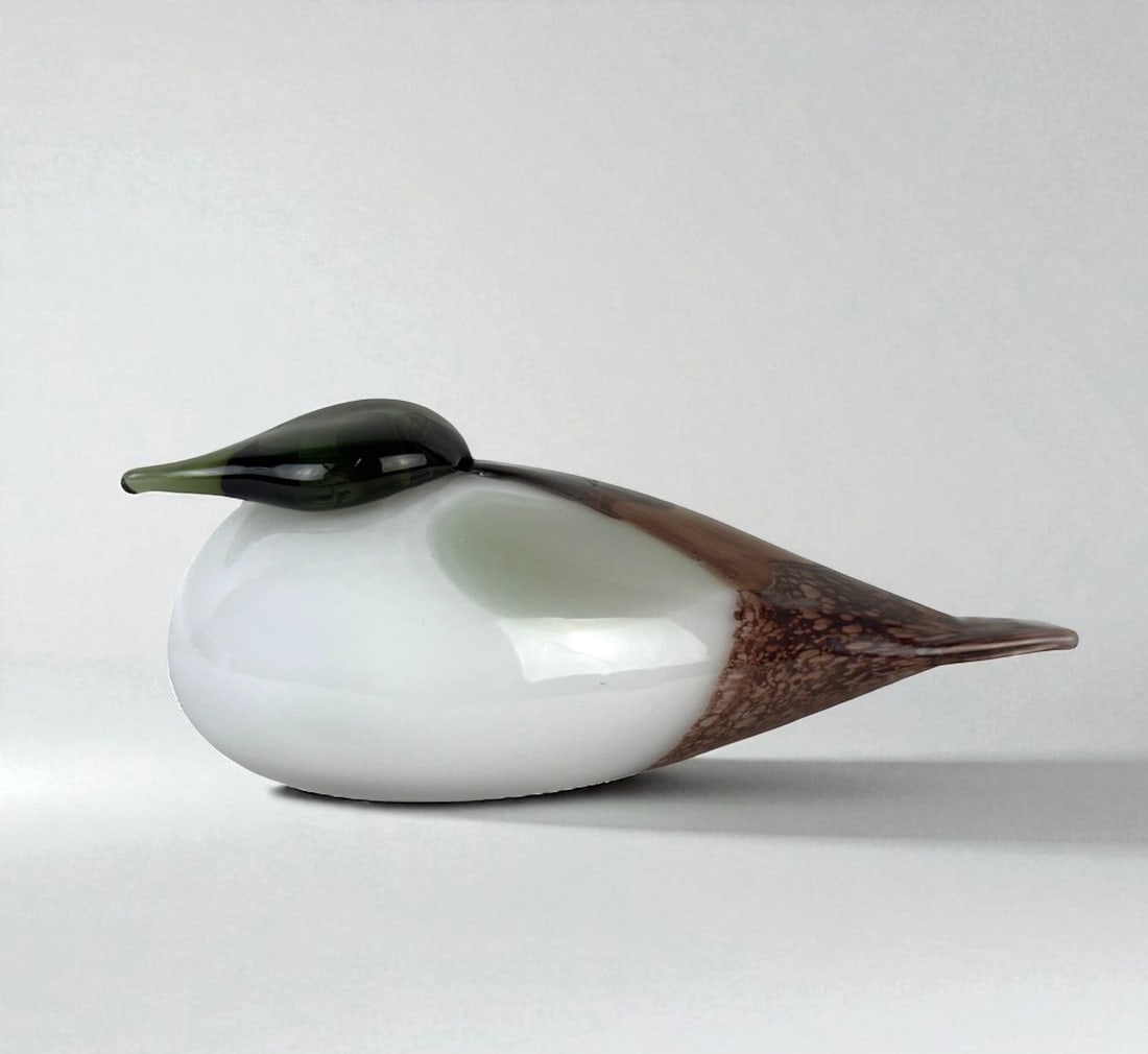 Oiva Toikka Iittala Glass Bird – White, Green & Brown: Signed "O. Toikka" on the base and retains the original “Iittala – Made in Finland” label. Dimensions: 3 1/2"H x 9 1/2"L Condition: Very good with no