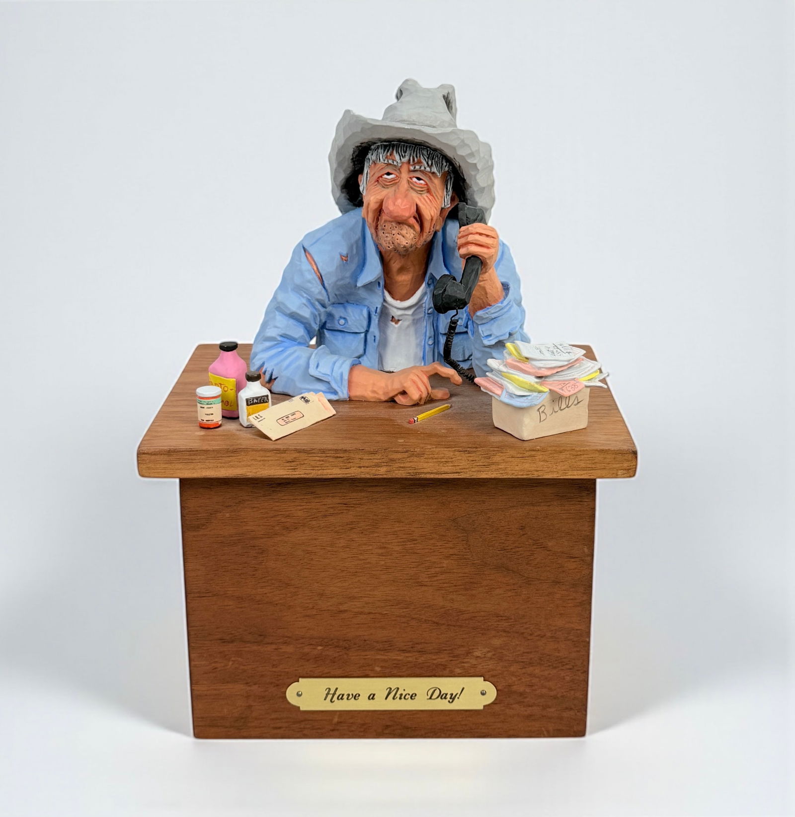 Gene Zesch "Have A Nice Day" Bronze & Wood Sculpture: Signed and numbered on the back. Medium: Bronze & Wood Edition: 17/50 Dimensions: 9"T x 6 3/4"W x 5"D Condition: The bolt securing the figure is missing, but the other b