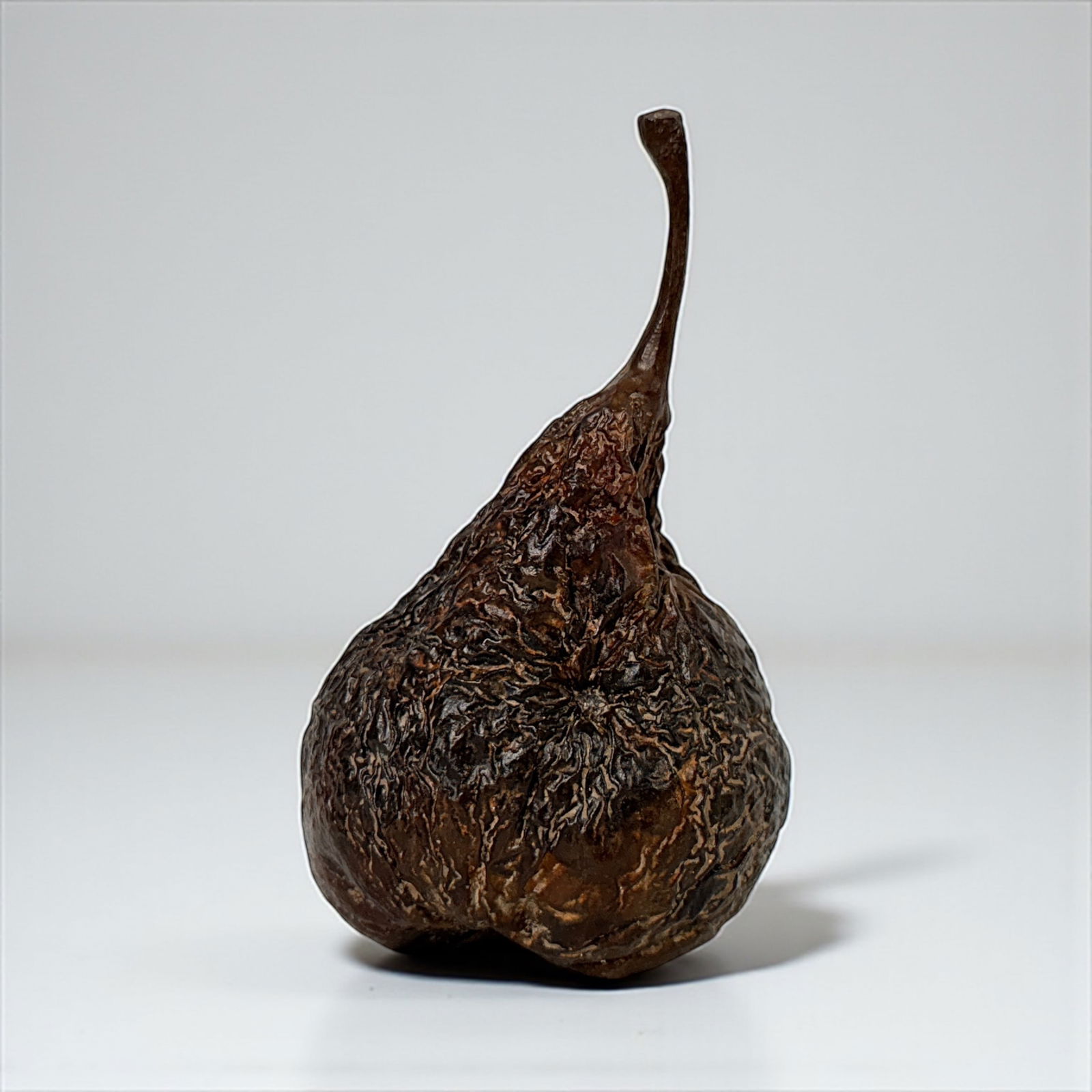 Laura Baring Gould Bronze Pear: The pears are cast in bronze using traditional bronze-casting techniques, then hand-finished and colored with a hot patina. Stamped “O B G” and “06” on the underside. Height: 4