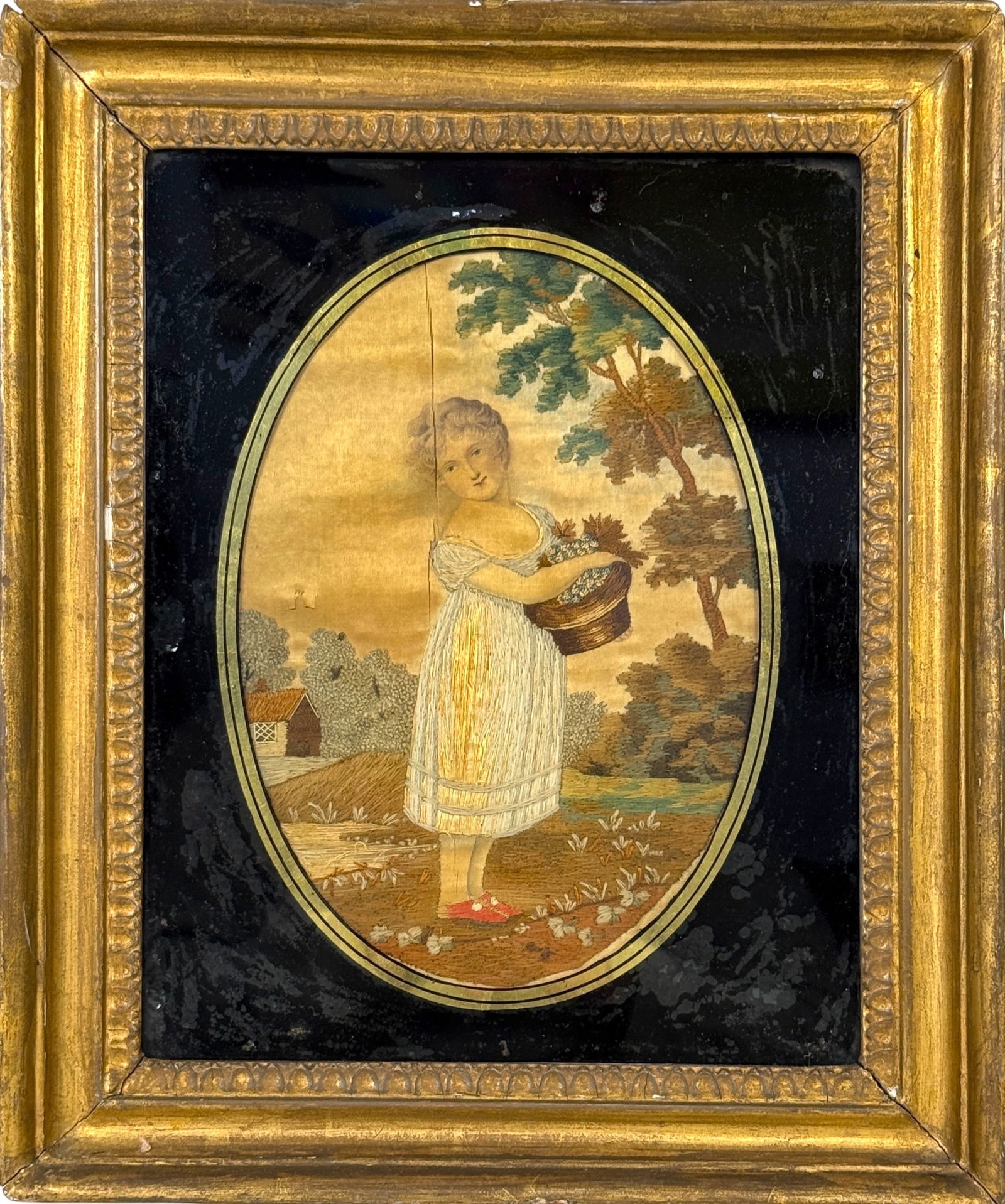 Antique Embroidery Of Young Girl With Basket: Frame:14 1/2" x 12" Image: 9 1/2" x 6 1/2" Condition: Bubbling to the matting glass and a split with a small indent in the fabric on the left side of the image. Small chips