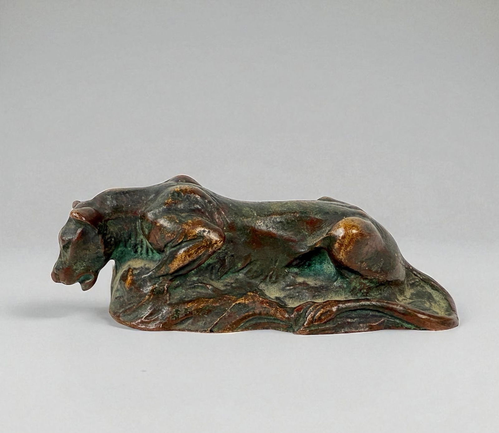Tiffany Studios Lioness Paperweight: Signed: Tiffany Studios, New York Number: 887 Dimensions: 1 1/2" H x 4"T Condition: Light patina consistent with age, otherwise in good condition.