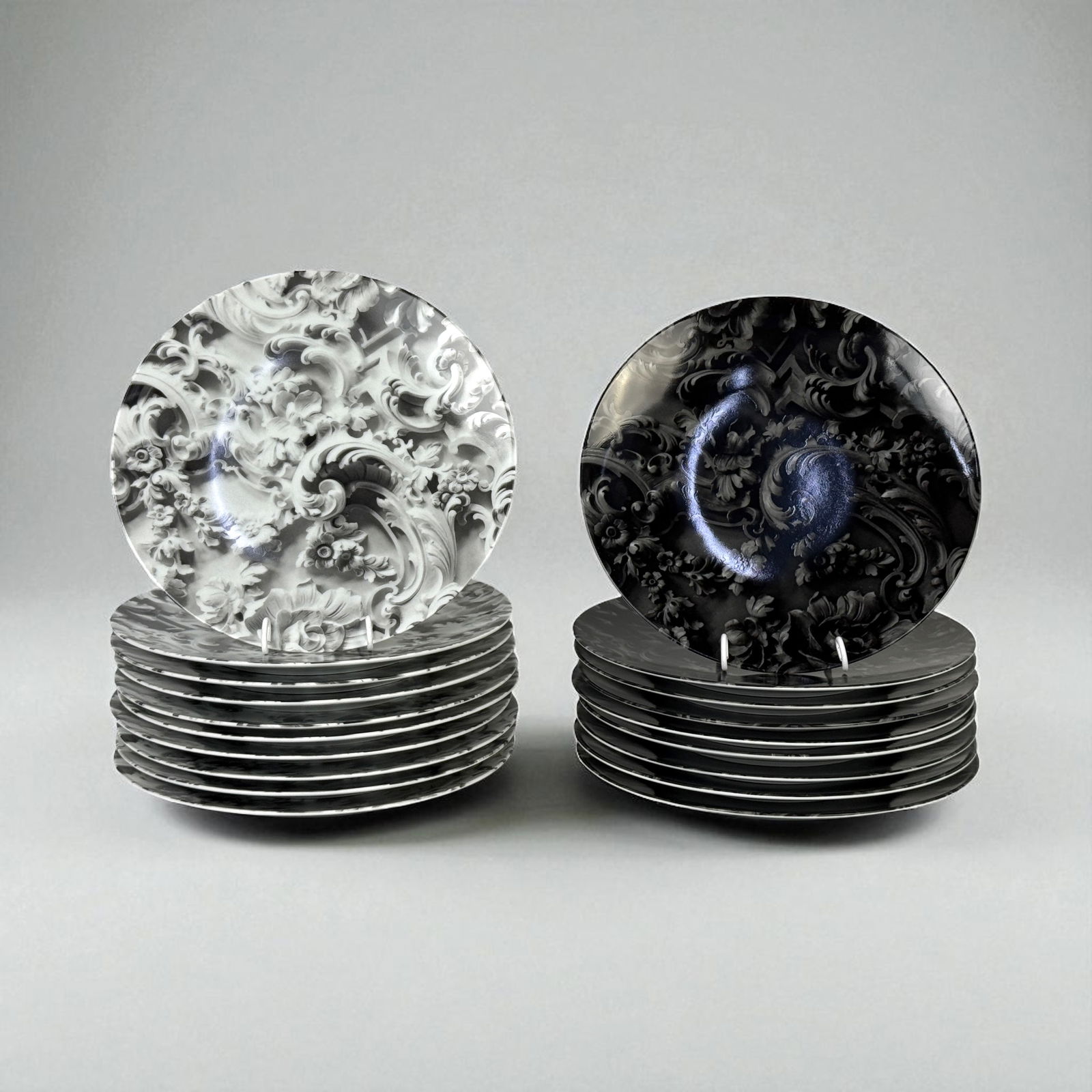 (19pc) Rudolf Stingel Bernardaud Porcelain Art Dinner Plates: (9) black & (10) white plates. Diameter: 10 1/4” Condition: All new in box