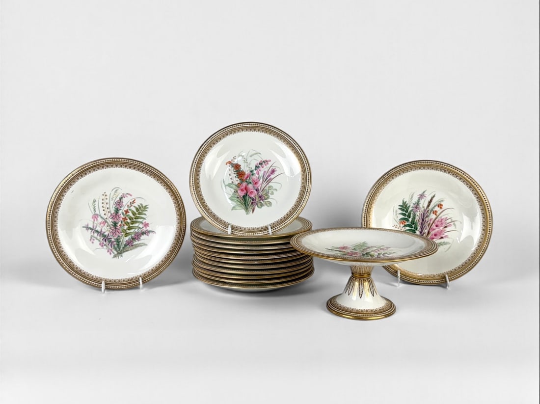 (15pc) Royal Worcester Floral & Gold Gilt Table Set:  Set Includes: (12) Dinner Plates: 9 7/8" diameter (2) Short Comptes: 9 1/2" x 2" (1) Tall Compote: 9 1/2" x 4 1/2" Condition: One of the short compotes has a chip