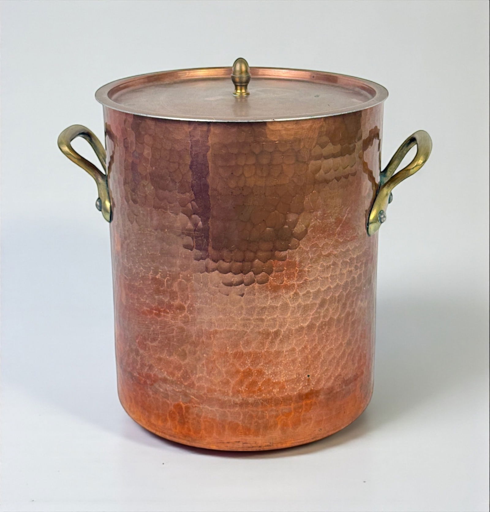 Lamalle Copper French Stock Pot: Height: 11 1/2" Condition: Good. Light surface wear and patina, with verdigris at the handle joints and small dark oxidation spots on the lid. The interior shows oxidation and surfac