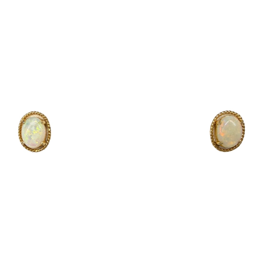 Pair of 18K Gold and Opal Earrings: Dimensions: 10.85mm Longest Side Total Weight: 1.56g (excluding backings) Condition: The earrings are in good condition. One post is slightly bent. 