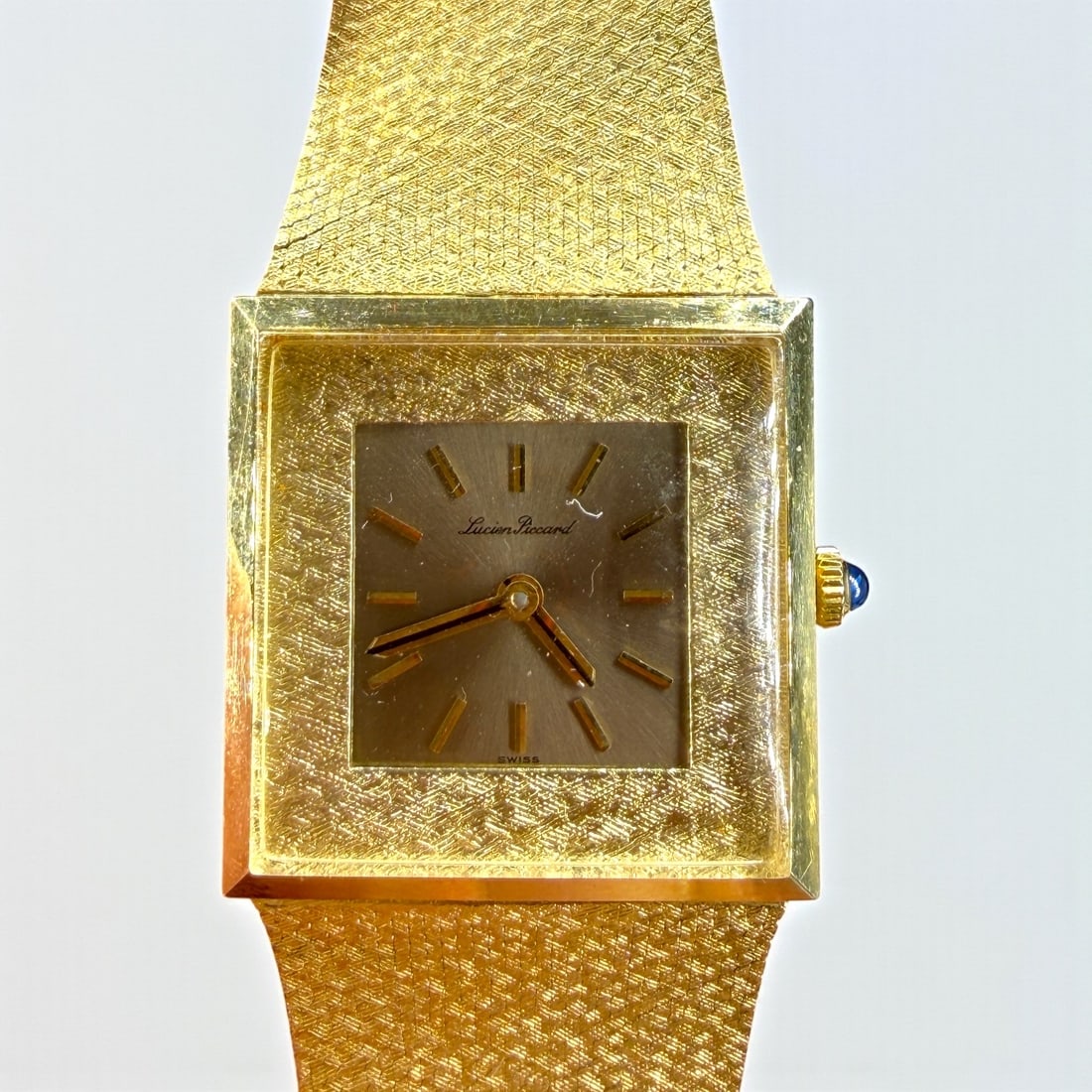 14K Solid Gold Lucien Piccard Watch: In the Original Case and Box Length: 7" Case: 1 1/8"x1 1/8" Total Weight (including movement): 70.8g Condition: Some warping at the band, and the clasp h