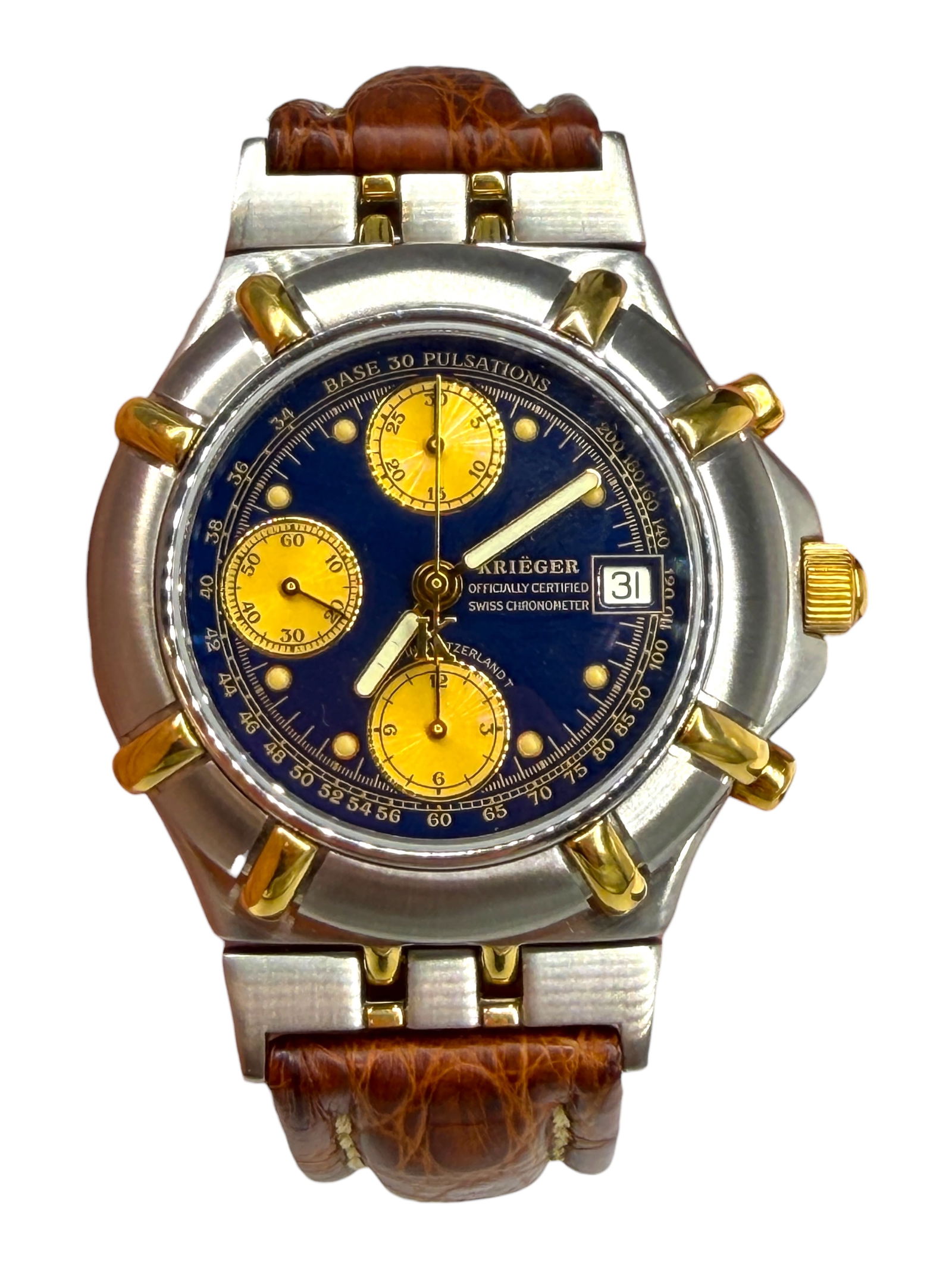 Krieger B929 Automatic 41mm Chronograph Stainless & Gold: Valjoux Movement is water-resistant to 100M. Blue Dial with Stainless/Gold Accents Case and Brown leather band. Condition: Very Good with minor evidence of wear. Crystal