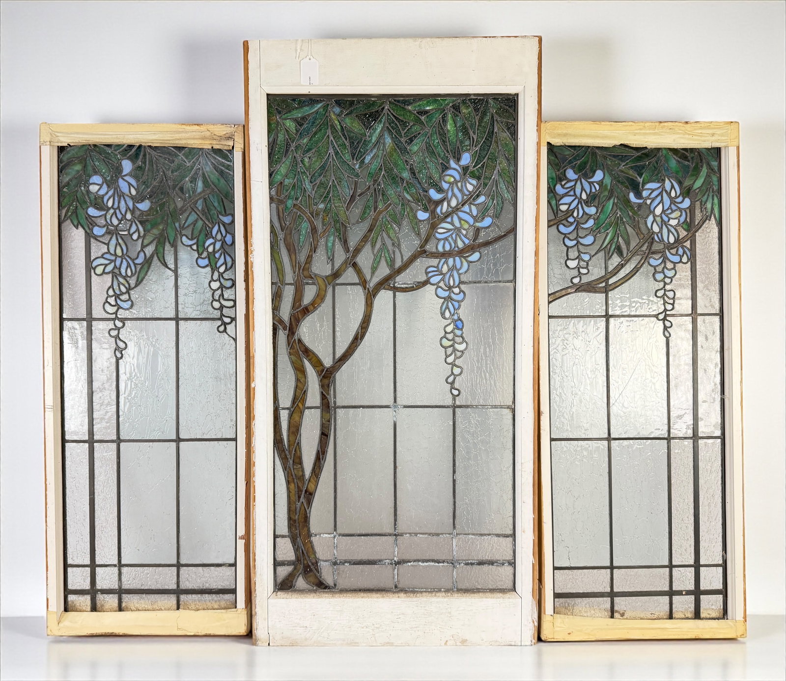(3pc) Antique Tiffany Style Stained Glass Window: Tiffany Studios Wisteria Style Dimensions: Outer panels each measure approximately 43 1/2" x 17" Center panel measures approximately 50" x 24" Condition:&nb