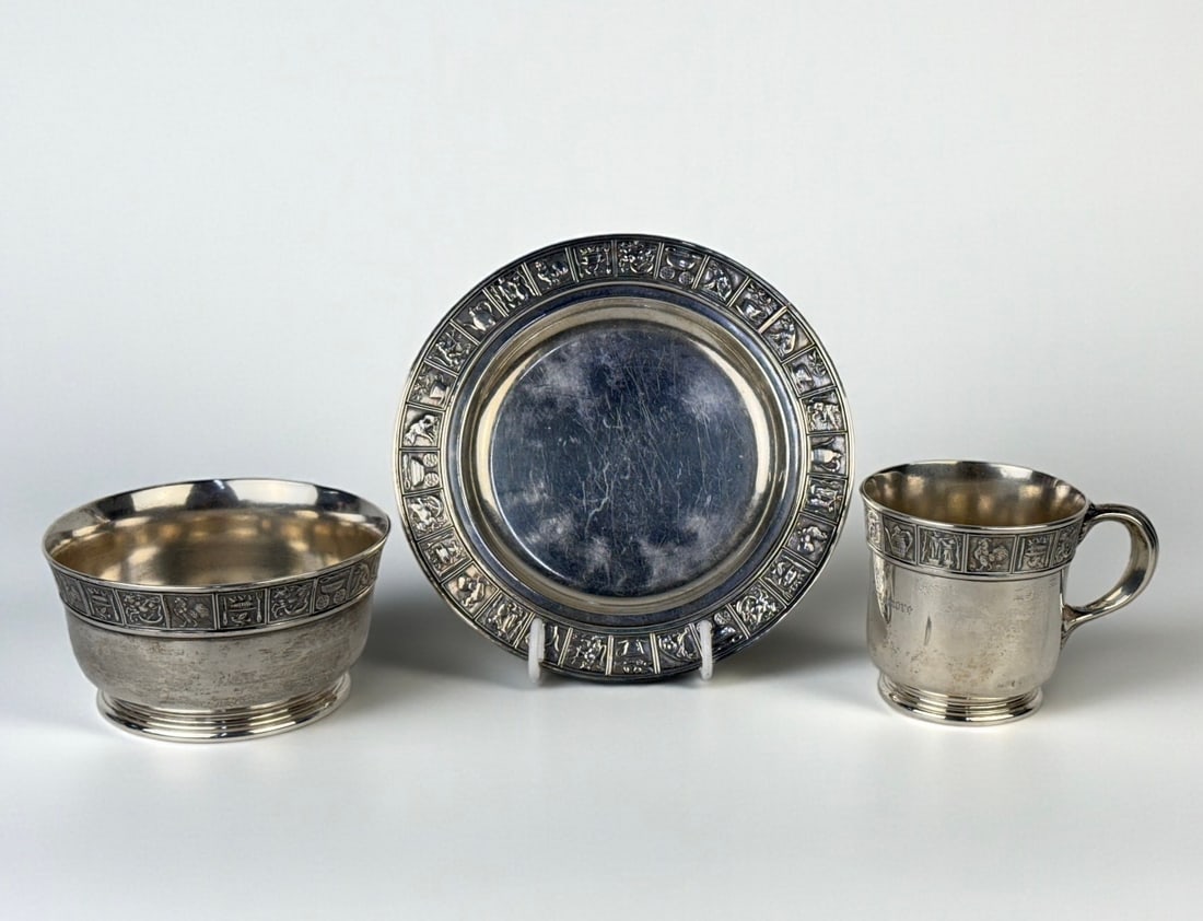 (3pc) Mother Goose Nursery Gorham Sterling Set: Dimensions of Bowl: 2 1/2" T x 4 3/4" W Total Weight: 17.9 ozt Condition: All pieces are in good condition with minor tarnishing. Surface scratching is consistent with age