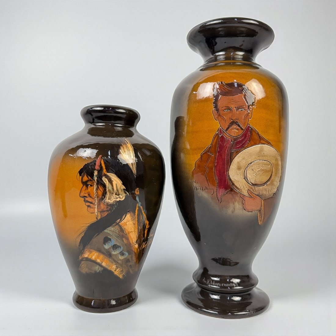 2 Rich Wisecarver Pottery Vasses: Both signed on the bottom. Height of the tallest: 17" Condition: The larger base has a repaired chip near the base, and the shorter one has a nick to the base as well; otherwise, in good c