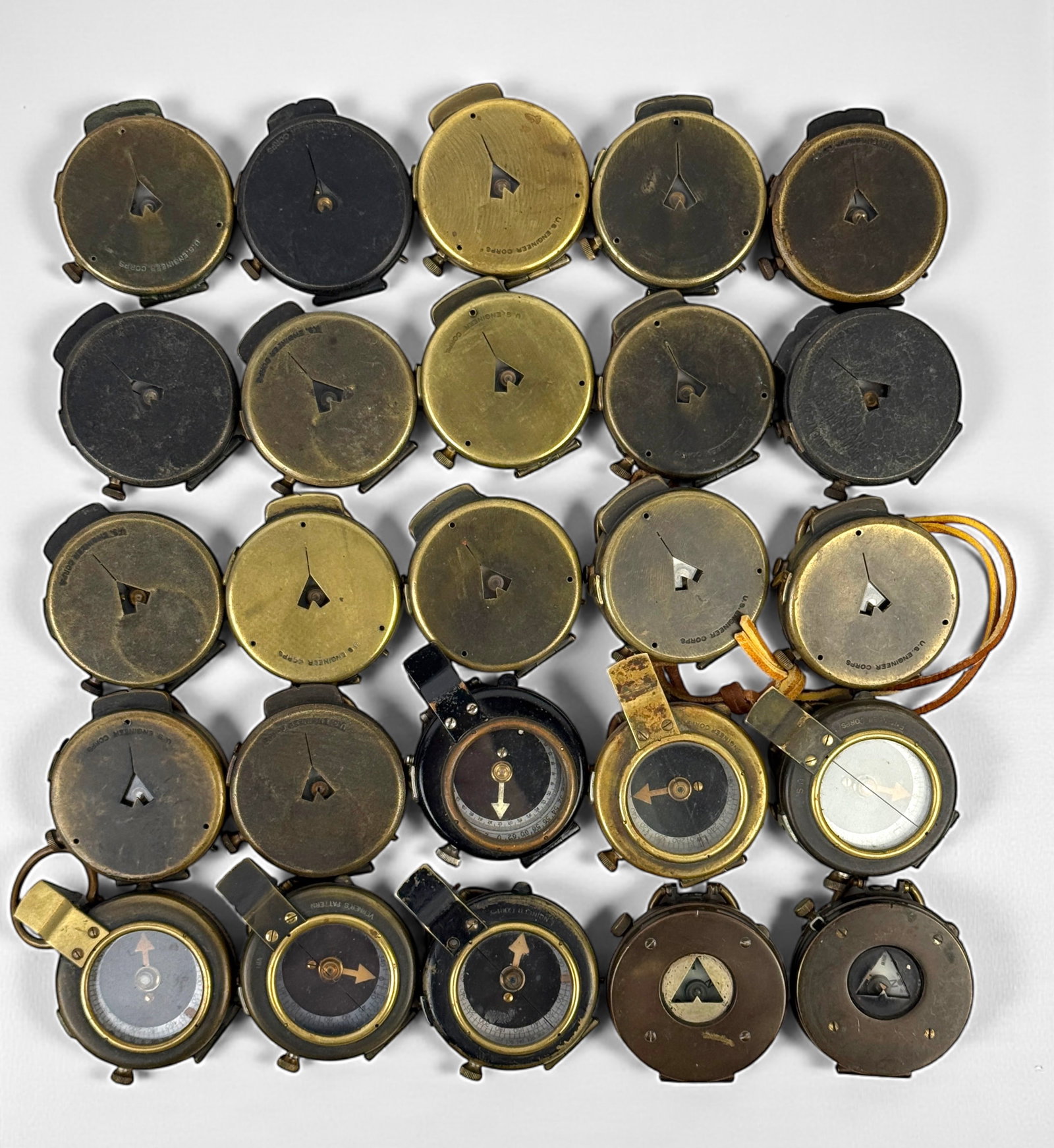 Group Of (25) WWI Military Compasses (E): Size: 2" Diameter Condition: Mixed condition throughout with wear, tarnish, scratches, and scattered oxidation from age and use. Working but untested for accuracy. Please refer to the