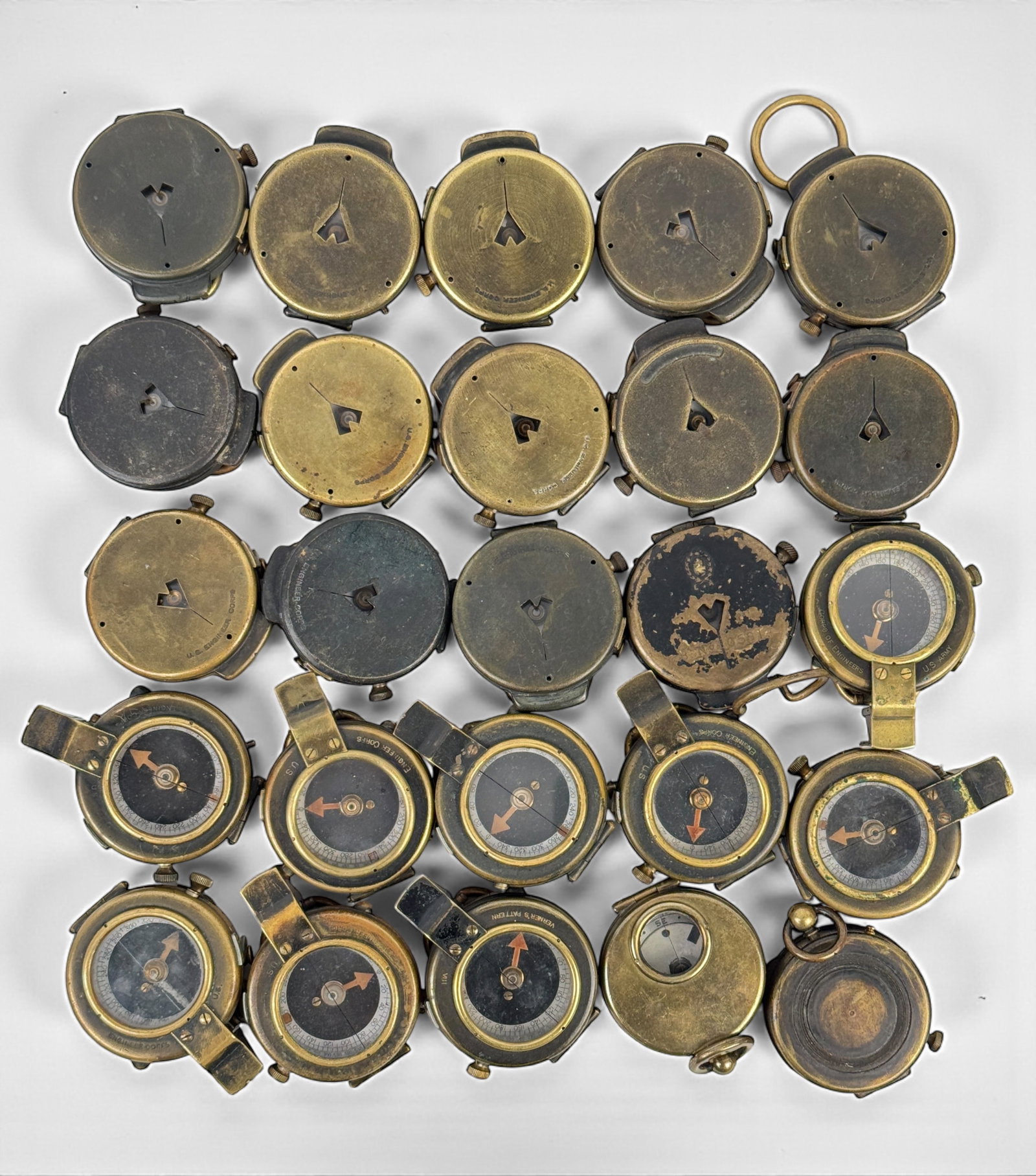 Group Of (25) WWI Military Compasses (G): Size: Each 2" Diameter Condition: Mixed condition throughout with wear, tarnish, scratches, and scattered oxidation from age and use. Most appear to be working but untested for accura