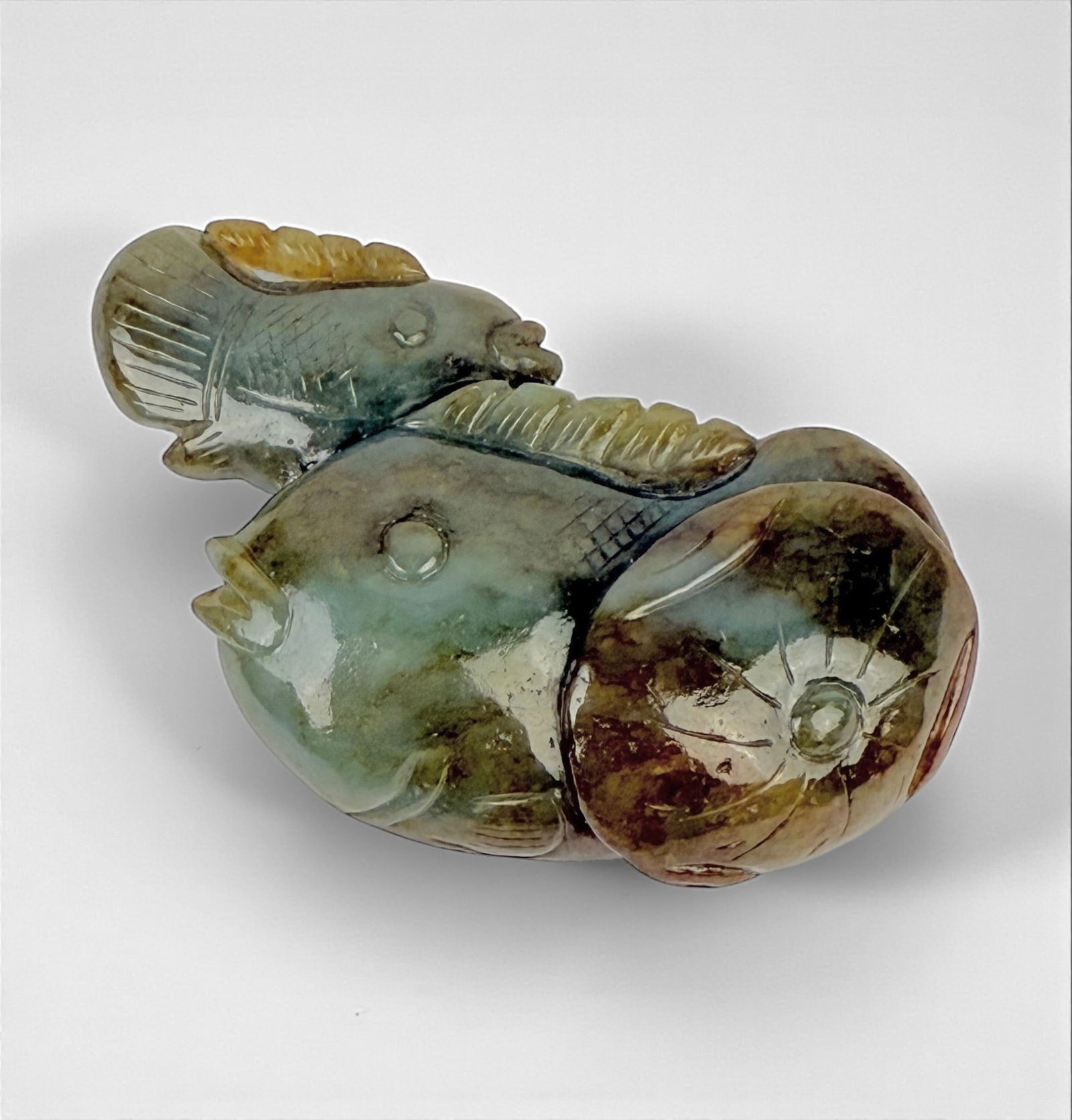 Chinese Jade Fish Paperweight: Dimensions: 2" T x 3 1/4" W x 1" DWeight: 136 grams Condition: Piece is in very good condition. There are some minor scratches to the surface of the stone, consistent with