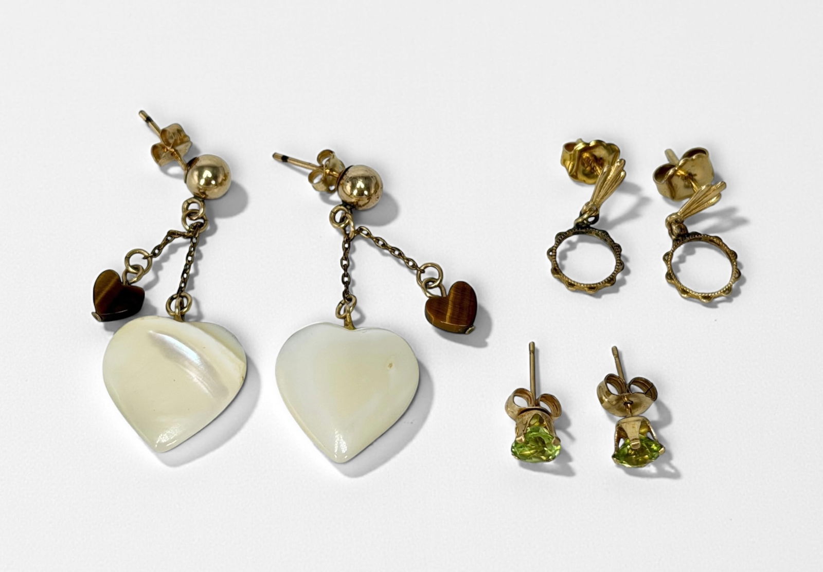 (3) Pairs of 14K Gold Earrings: Longest Pair: 1 1/2" Total Weight: 4.7g Condition: Earrings are in good condition. See images for details. 