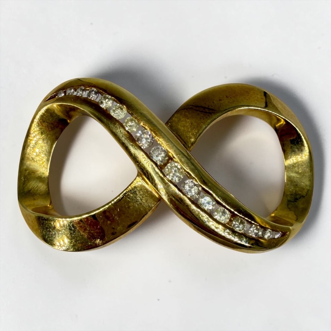 14K Gold & Diamond Infinity Slide Pendant: Dimensions: 1" x 1 3/4"Weight: 9.8g Condition: In good condition. 