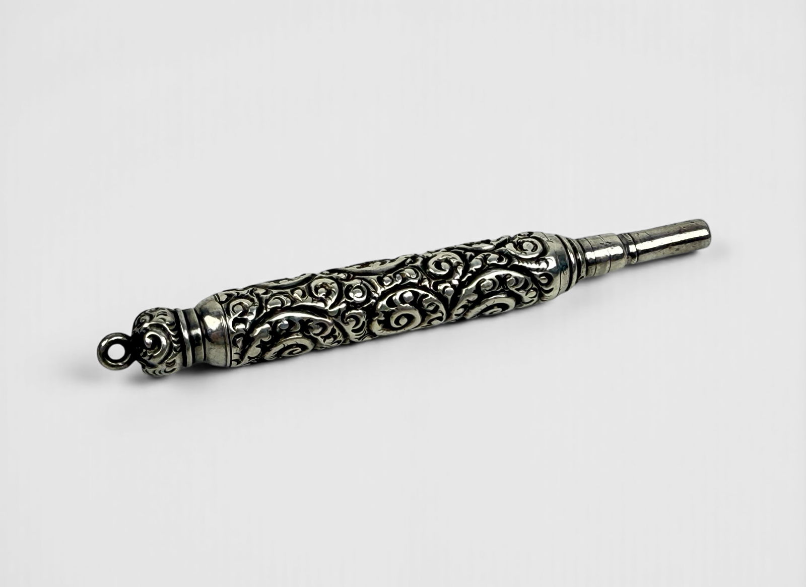 Sterling Antique Repousse Propelling Pencil: This pencil would have been a part of a chatelaine. Dimensions: 4 1/2" when fully extended. Total Weight: 0.6ozt Condition: The pencil is in good condition. When the