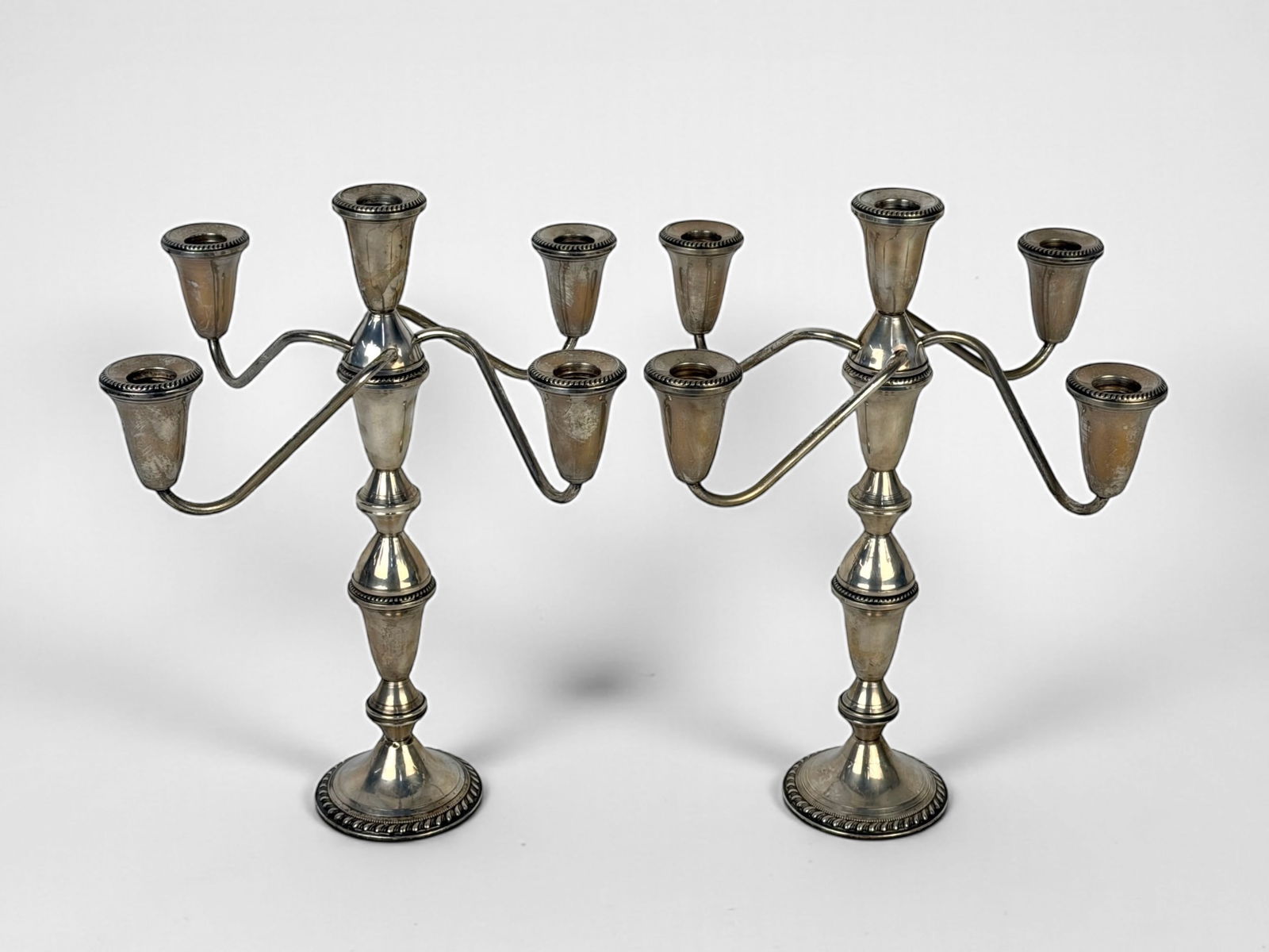 (2) Vintage Duchin Creations 5 Light Sterling Candelabras: Height: Approx. 13 1/2" Total Weight: 60.2ozt Condition: Some tarnishing to the surface, otherwise both candelabras are in good condition. 