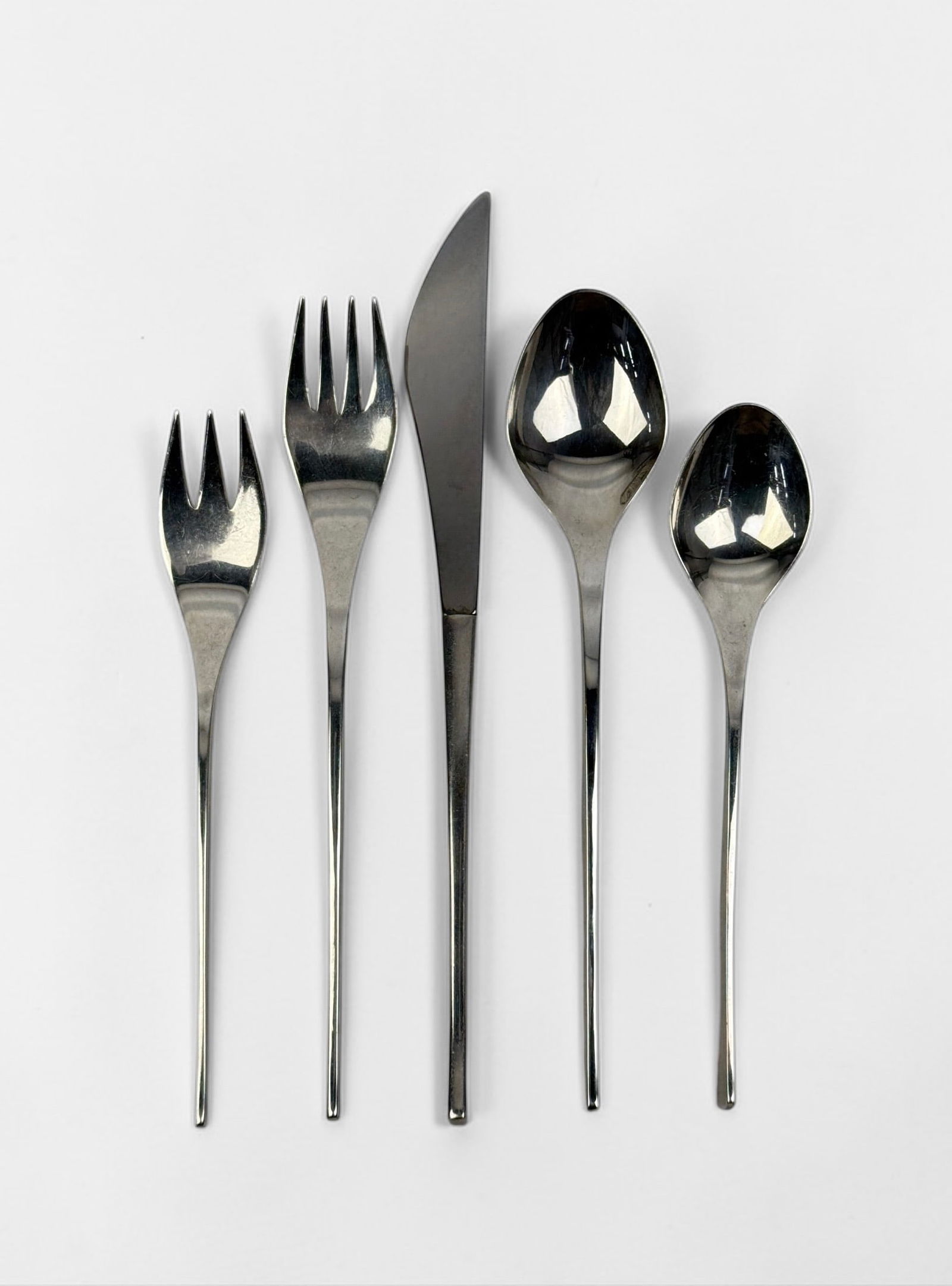 (45 pc) International Vision Sterling Flatware Set: Service For 8 Set Includes: (8) Dinner Knives 8 5/8" (8) Dinner Forks 7 1/2" (8) Salad Forks 6 1/2" (8) Table Spoons 7 1/2" (8) Teaspoons 6 3/8" (5) Assorted Serving Pieces To