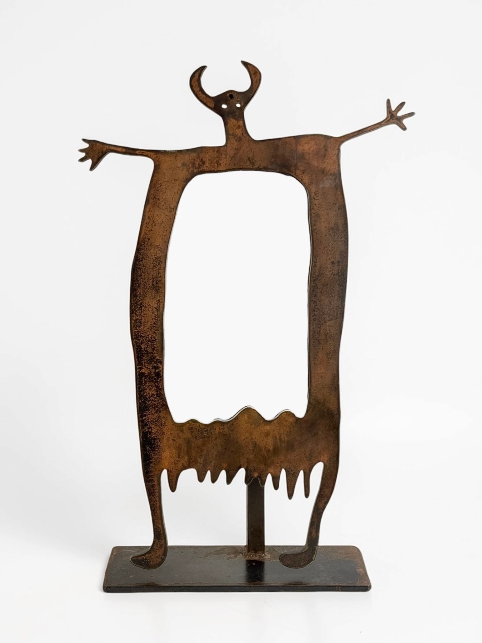 Doug Weigel Decorative Iron Mirror: Dimensions: 21" x 14" x 4" The mirror is hinged to change the angle. Condition: Some rust and oxidation to the metal. The mirror slides out from the top, and it can be angled back