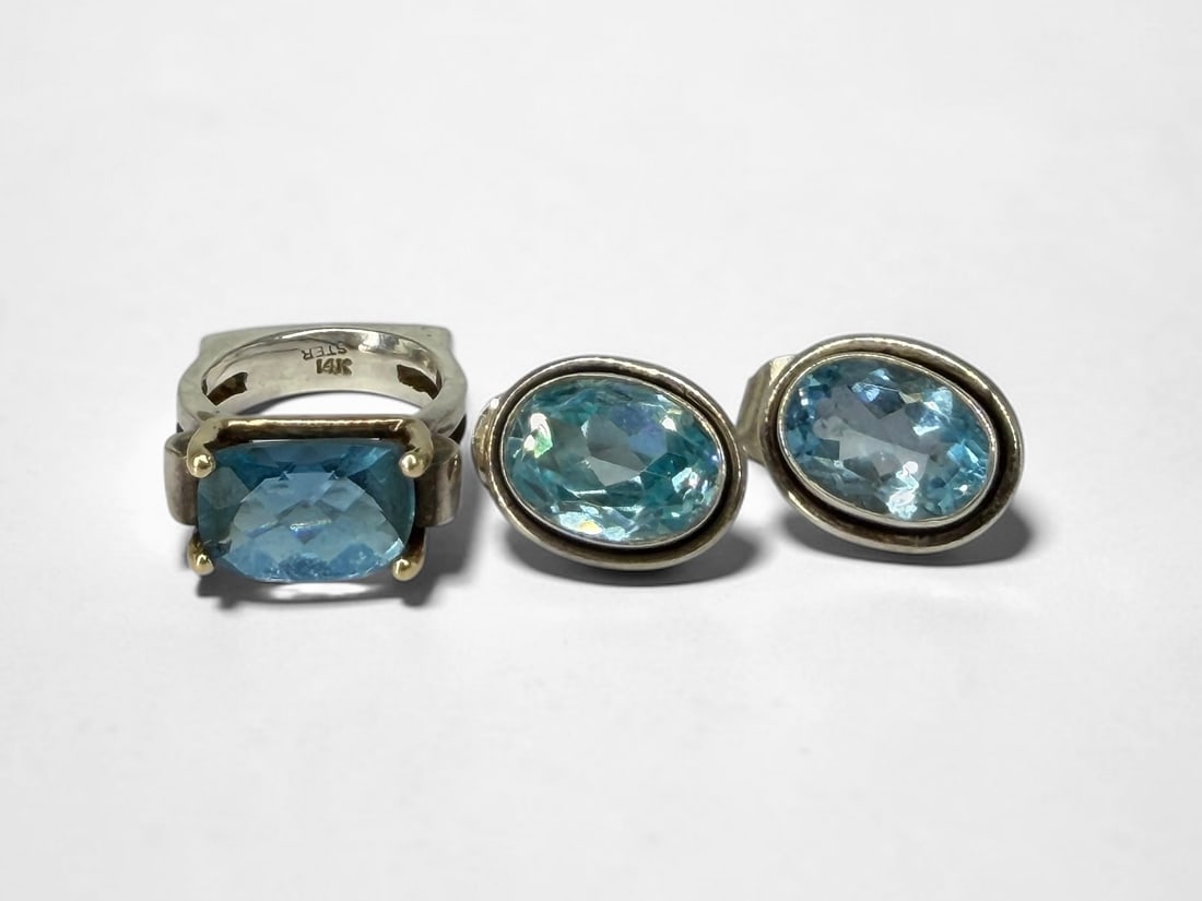 14K Sterling Blue Topaz Ring and Earrings: Ring Size: 6Setting Dimensions: 10mm x 13.7mmEarrings Dimensions: 17.9mm x 14mm Total Weight: 19.2g Condition: Light surface scratches to the ring, consistent with use. Otherwise, the