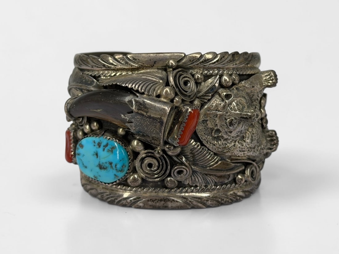 Jason Livingston Sterling Silver Bear Claw Navajo Cuff: Weight: 117gDimensions: 2 1/4" Inner Diameter and 1" opening Condition: The largest turquoise stone is loose in its setting. 