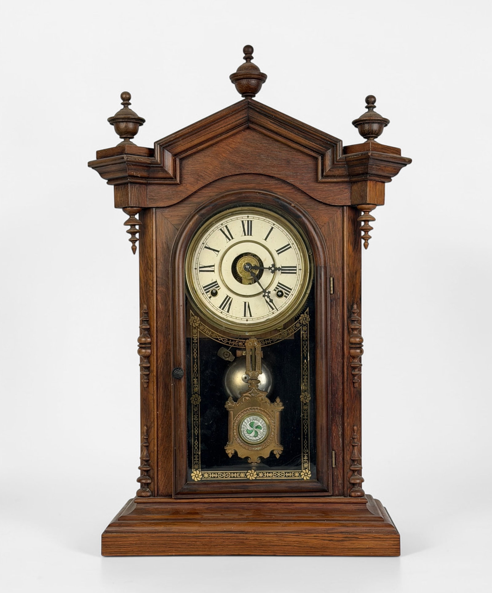 Welch, Spring & Co. “Lucca?? 1880 Clock: Dimensions: 23 1/2" x 13 1/2" x 6" Condition: Minor wear to the face. The top-left decorative piece is loose but still attached to the clock. Not tested for time keeping. 