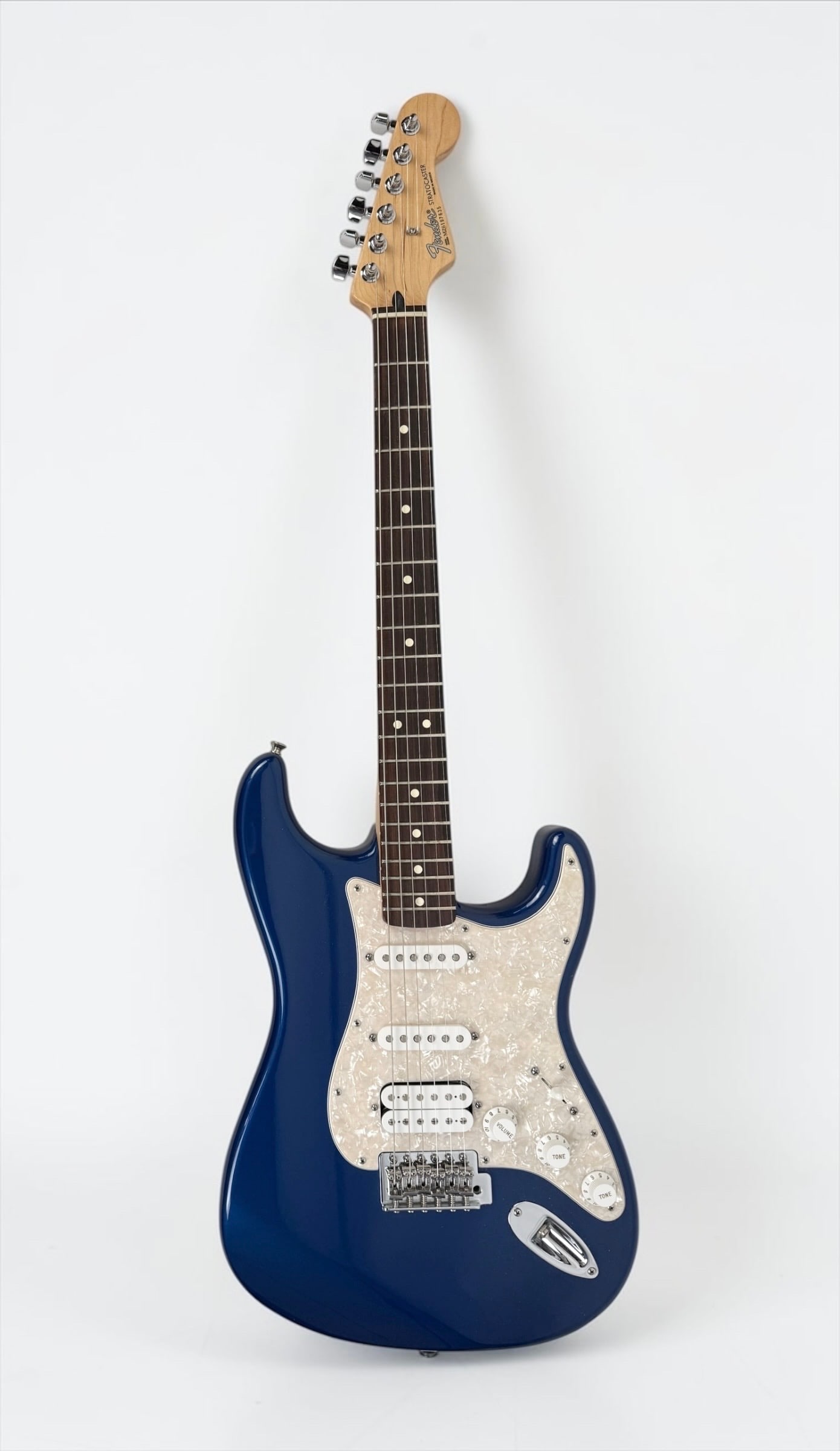 2006 Fender Metallic Blue Stratocaster Electric Guitar: Color: Metallic Blue Serial Number: MZ 6197635 Case: Fender Hard Case Year: 2006 Notes: White Peraloid pickguard and pickups Dimensions: 38 1/2" Condition: Toning