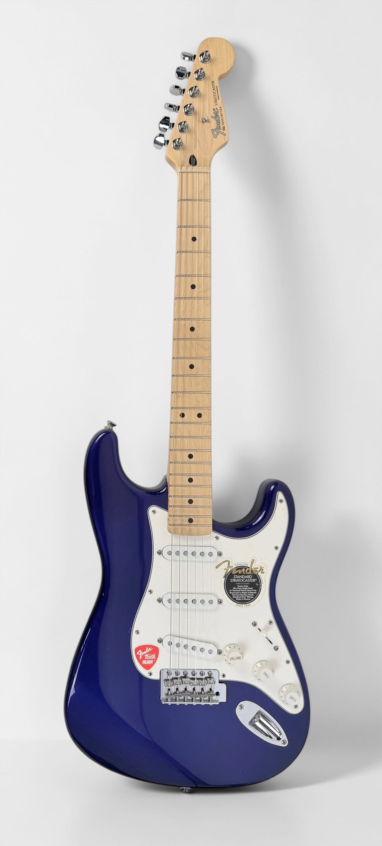 1998 Fender Stratocaster Electric Guitar: Color: Mystic or Midnight Blue Neck: Maple Electronics: Three single-coil pickups Hardware: Chrome hardware, including a standard synchronized tremolo bridge Serial Number: MN8287394 Case: