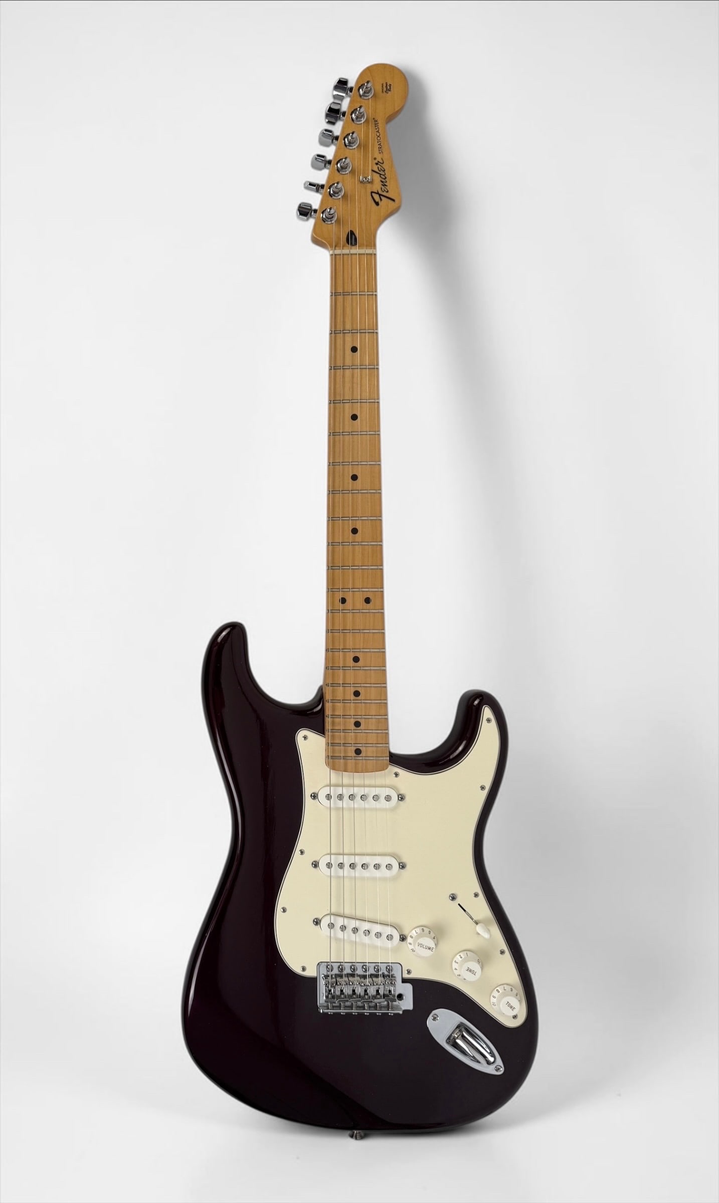 2010 Fender Stratocaster Electric Guitar: Color: Midnight Wine Serial Number: MX10268574 Case: Fender Hard Case Notes: White pickguard, chrome hardware, and original hangtags in case. Dimensions: 38 1/2" Long Conditio
