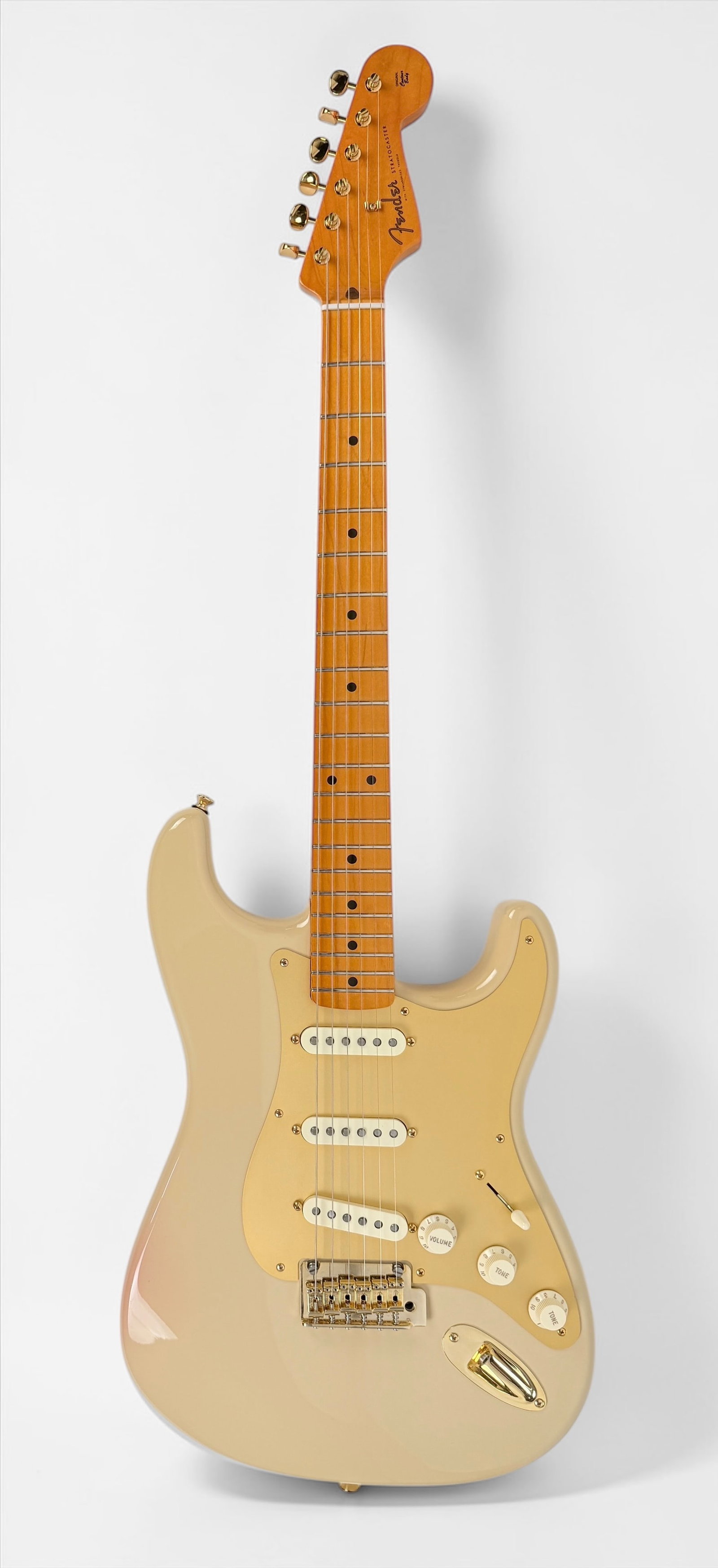 Fender 60th Anniversary Stratocaster Electric Guitar: Paperwork included. Color: Cream Body/Neck Material: Alder body and maple neck. Hardware: Gold colored tuners and output jack, silver colored bridge. Pickguard: Gold colored pickguard. Ser