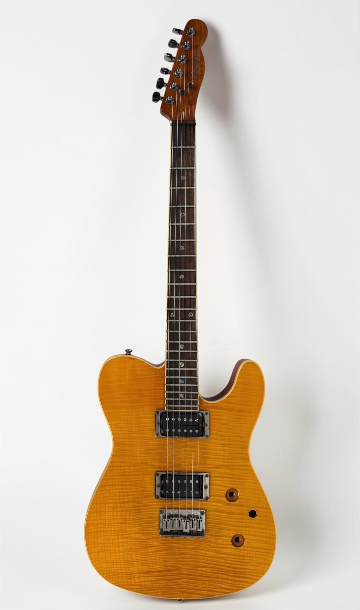 2001 Fender Special Edition Custom Telecaster FMT HH Electric Guitar: Color: Amber Serial Number: 03070286 Case: Hard Case Dimensions: 39" Long Condition: The guitar needs new pods and wiring. Otherwise, the guitar is in good condition. 