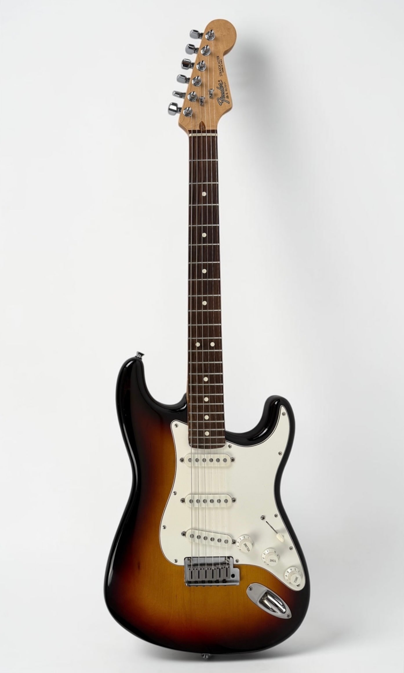 1989 Fender American Standard Stratocaster Electric Guitar: Color: Sunburst Serial Number: E 903641 Case: Hard Case Dimensions: 38" Long Condition: The guitar is in good condition. 