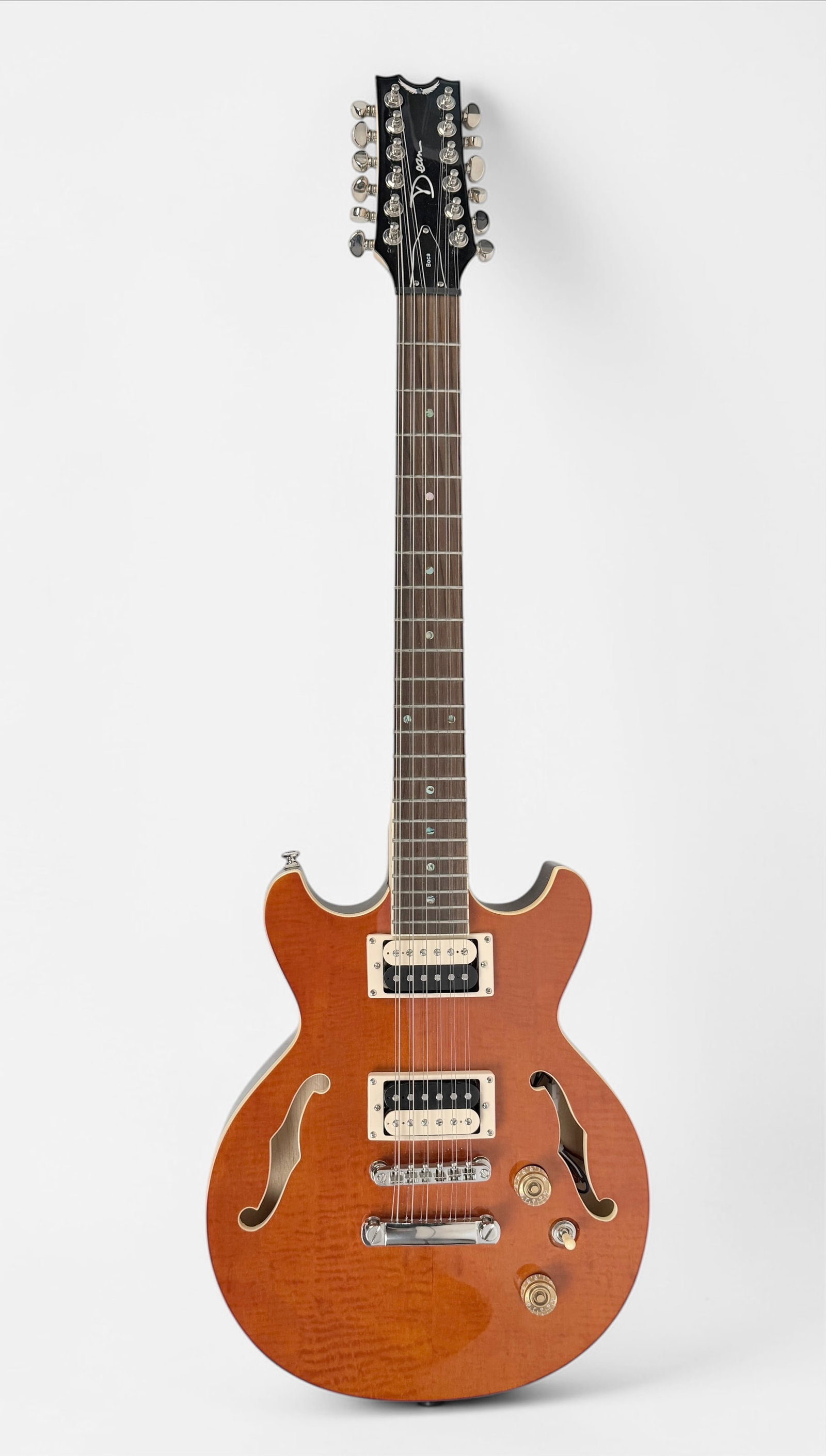 2012 Dean 12 String Semi-Hollowbody Electric Guitar: Color: Translucent Orange Hardware: Silver colored hardware Pickups: Dual humbuckers Serial Number: US12110419 Case: Road Runner Hard Case Dimensions: Guitar: 39" x 13" x 2