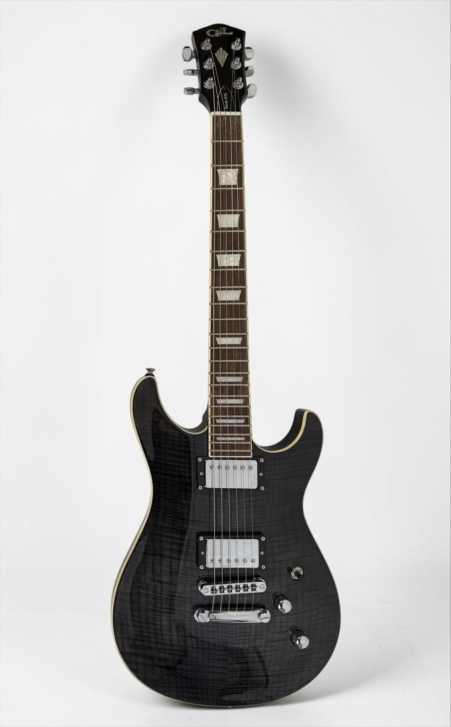 2011-2012 G&L Tribute Ascari GTS Electric Guitar: Color: Transparent Black Serial Number: 130408728 Dimensions: 38" Long Condition: In good condition. 