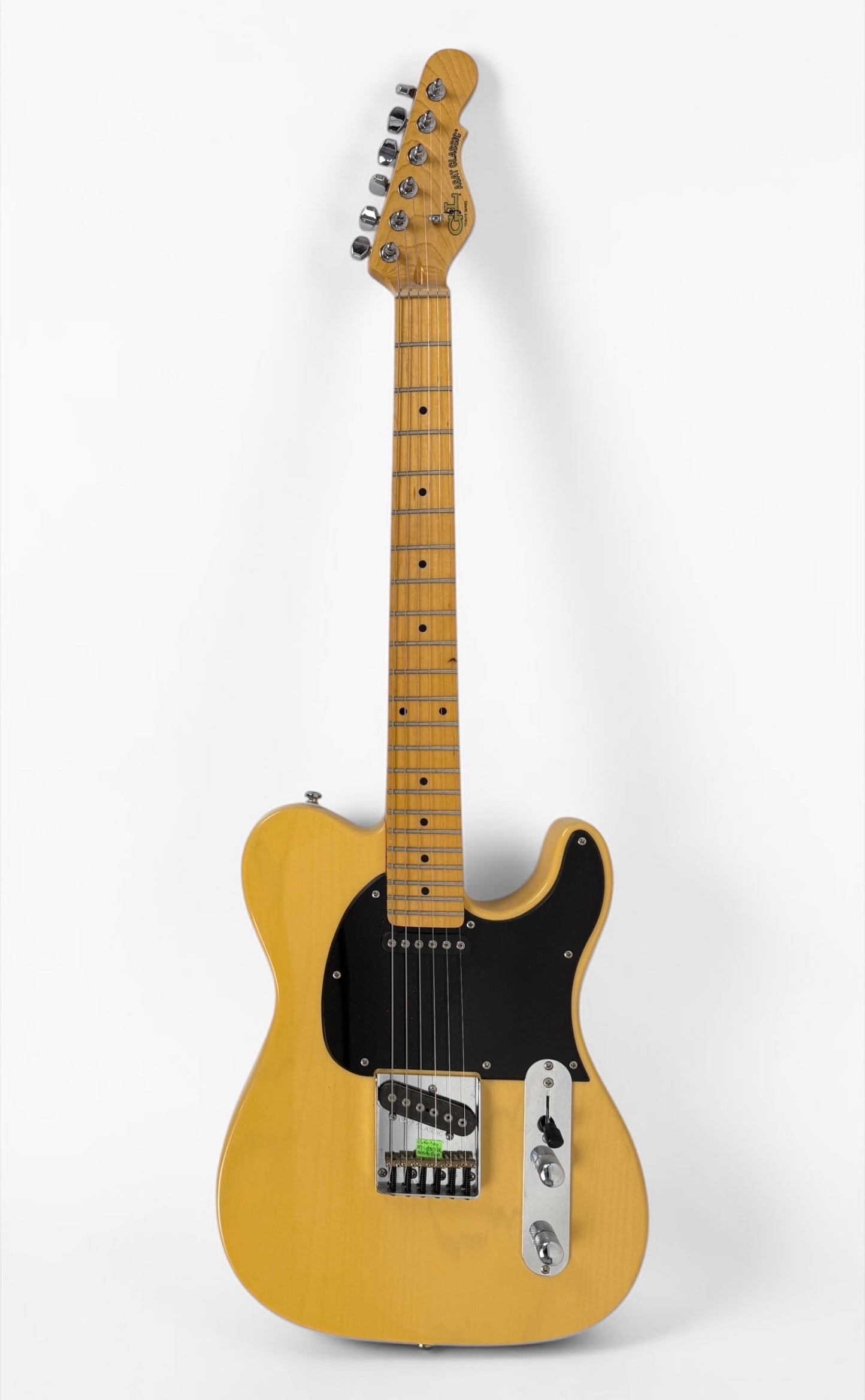 2013 G&L Tribute ASAT Classic Electric Guitar: Color: Butterscotch Blonde Serial Number: 130212219 Dimensions: 39" Long Condition: The guitar is in good condition. 