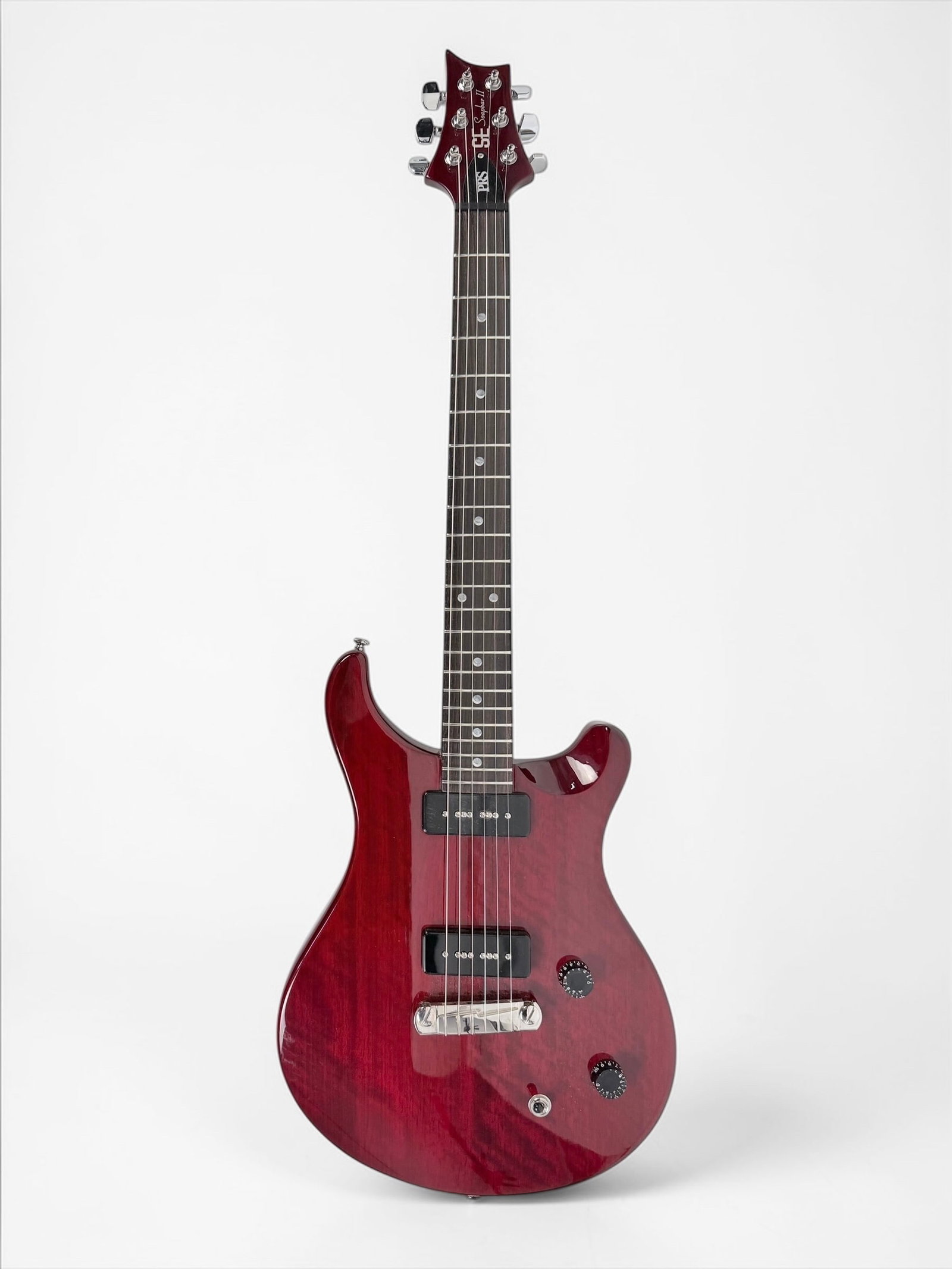2004 PRS SE Soapbar II Electric Guitar: Color: Burgundy Body/Neck: Double-cutaway mahogany body and neck with a rosewood fretboard Hardware: chrome colored tuners and hardware Electronics: two P-90 pickups, stop-tail bridge, and 3-way toggl
