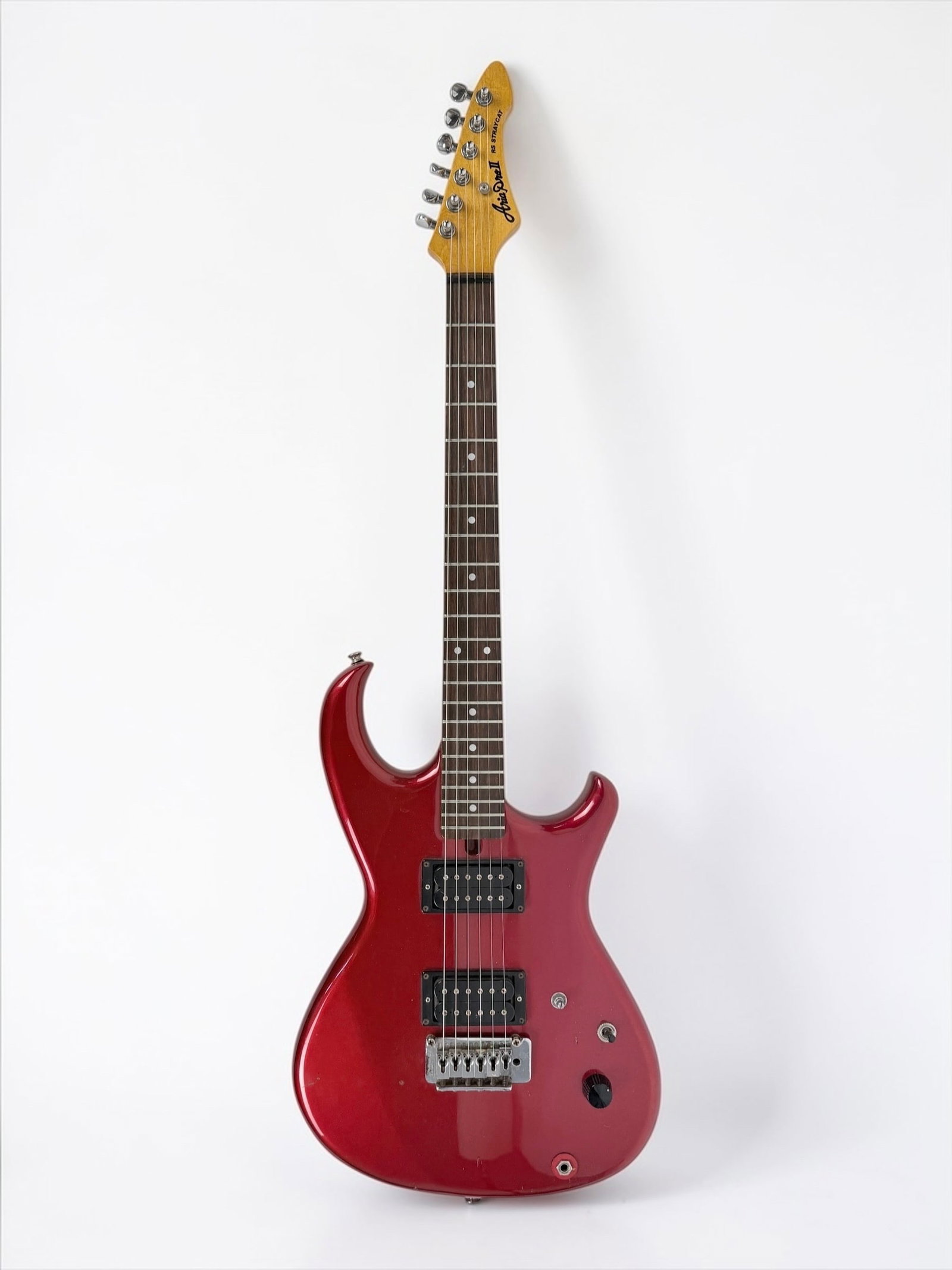 1980s Aria Pro II - "Stray Cat" Electric Guitar: Color: Red Neck Material: Maple neck with a rosewood fretboard. Serial Number: Not Available Case: Soft Case Dimensions: Guitar: 39" x 13" x 2" Case: 41" x 13 1/2"