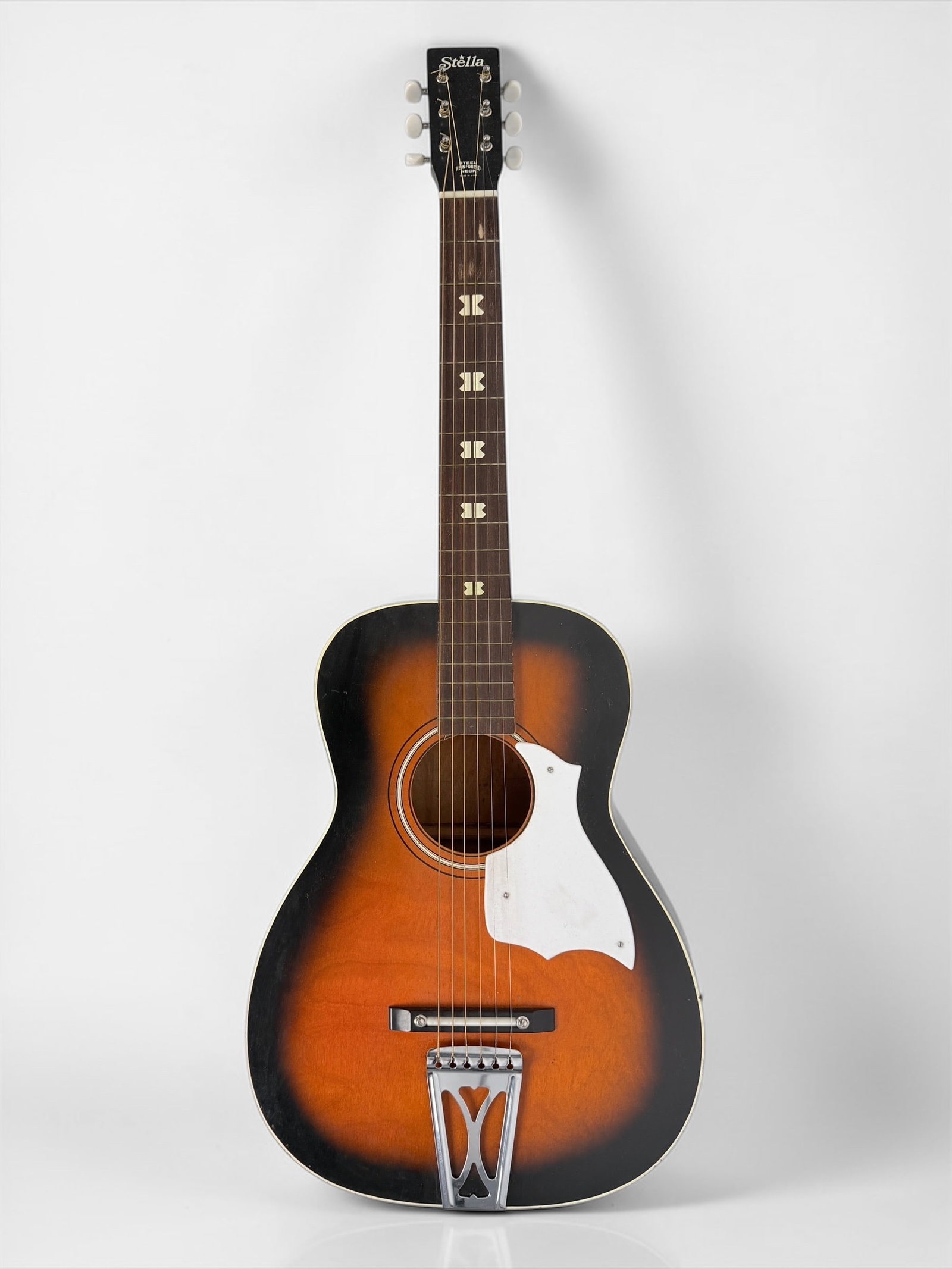 Stella USA Acoustic Guitar: Color: Natural Serial Number: 764SH6130 Case: Soft Case Dimensions: Guitar: 36" Long Case: 39" Long Condition: The guitar has minor wear throughout, consistent wit