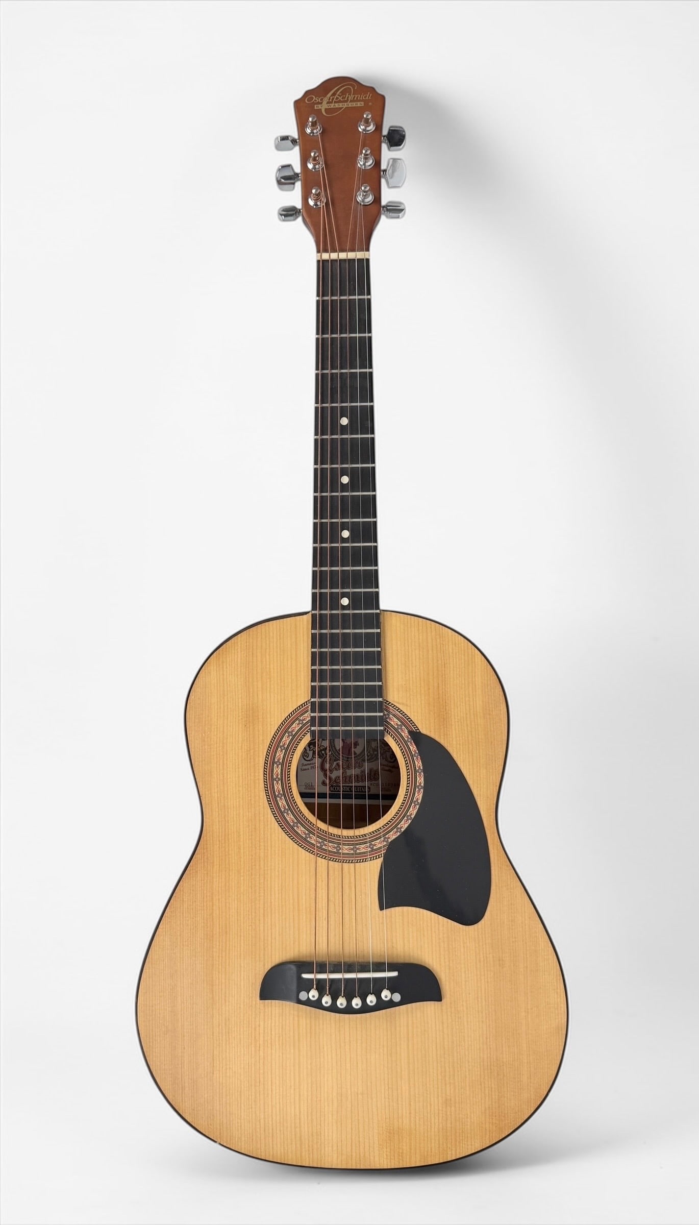 2000s Oscar Schmidt OG-1 Acoustic Guitar: Color: Natural Body: Spruce and Maple body with a rosewood neck and fretboard. Serial Number: KC00110349 Case: Soft Case Dimensions: Guitar: 36" x 13" x 3 1/2" 
